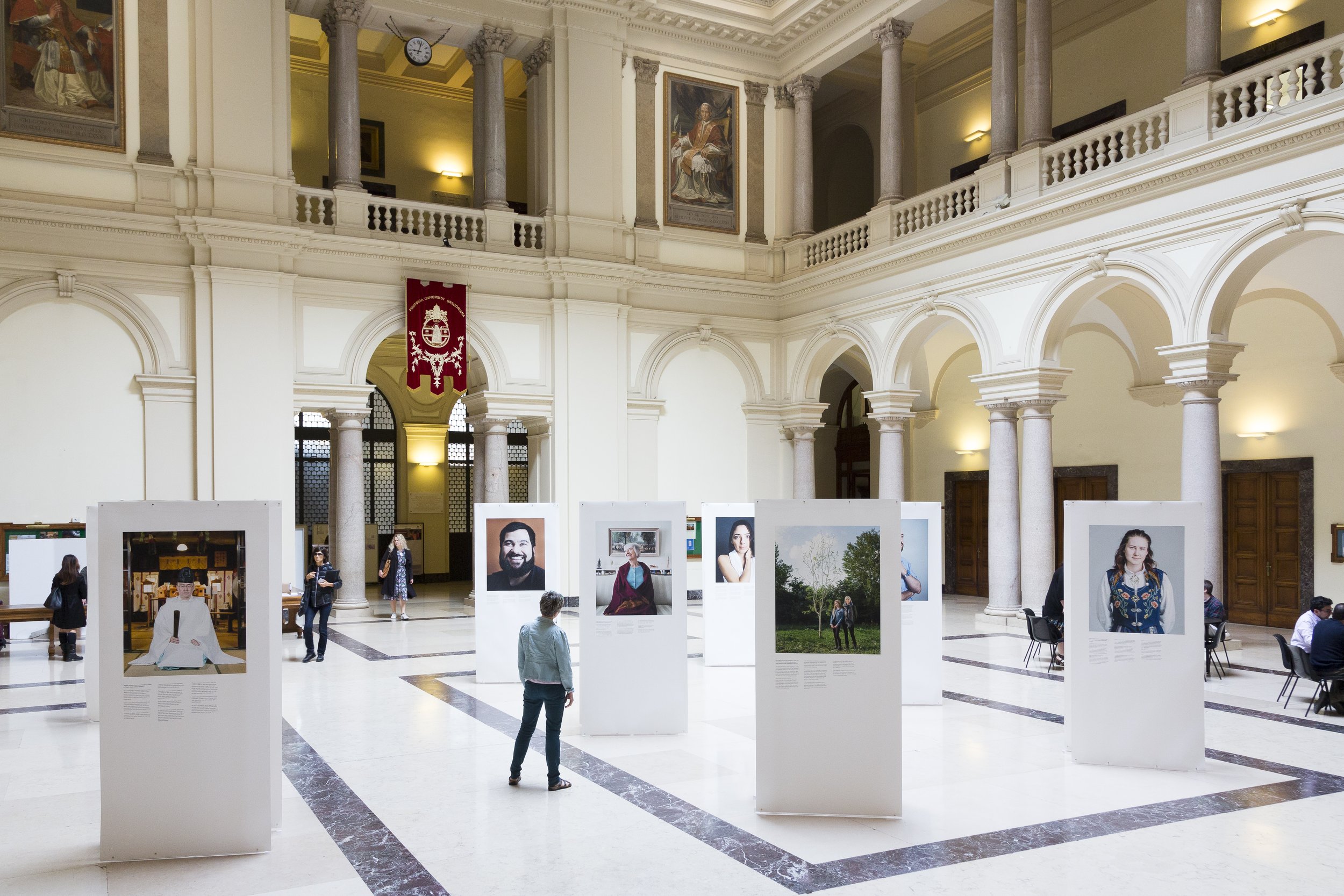  Exhibition of Aubrey Wade's 'Unbelievers' project at the Gregorian Pontifical University in Rome, Italy, during the Understanding Unbelief programme's capstone conference, 28 - 30 May 2019. The portraits and stories in the exhibition give an insight