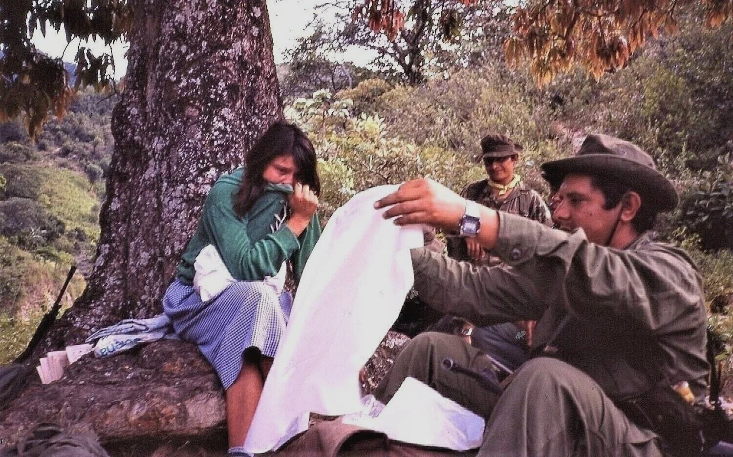 JUST CAPTURED  —  first interrogation of  pregnant FMLN guerrilla (finding the baby clothes in her backpack), near San Fernando, El Salvador   
(1984)