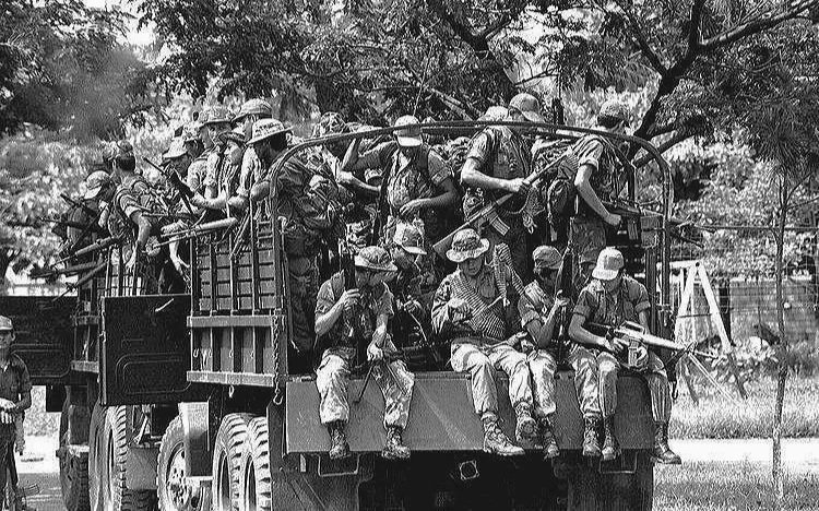 TAILGATE PARTY     —    soldiers of Monterrosa’s 3rd Brigade heading out on operation, San Miguel