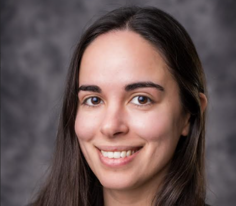 Smiling woman with long, dark hair