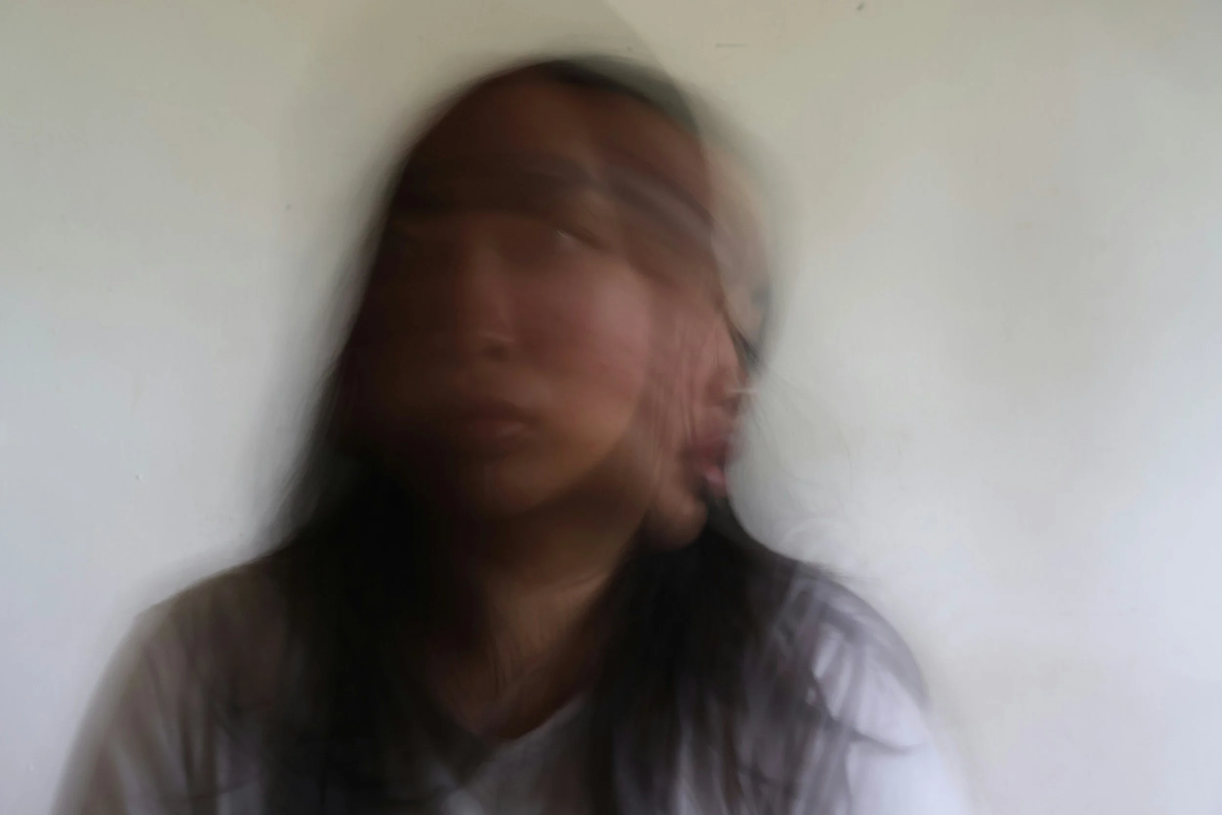 Woman experiencing freeze response and self-abandonment pattern in workplace