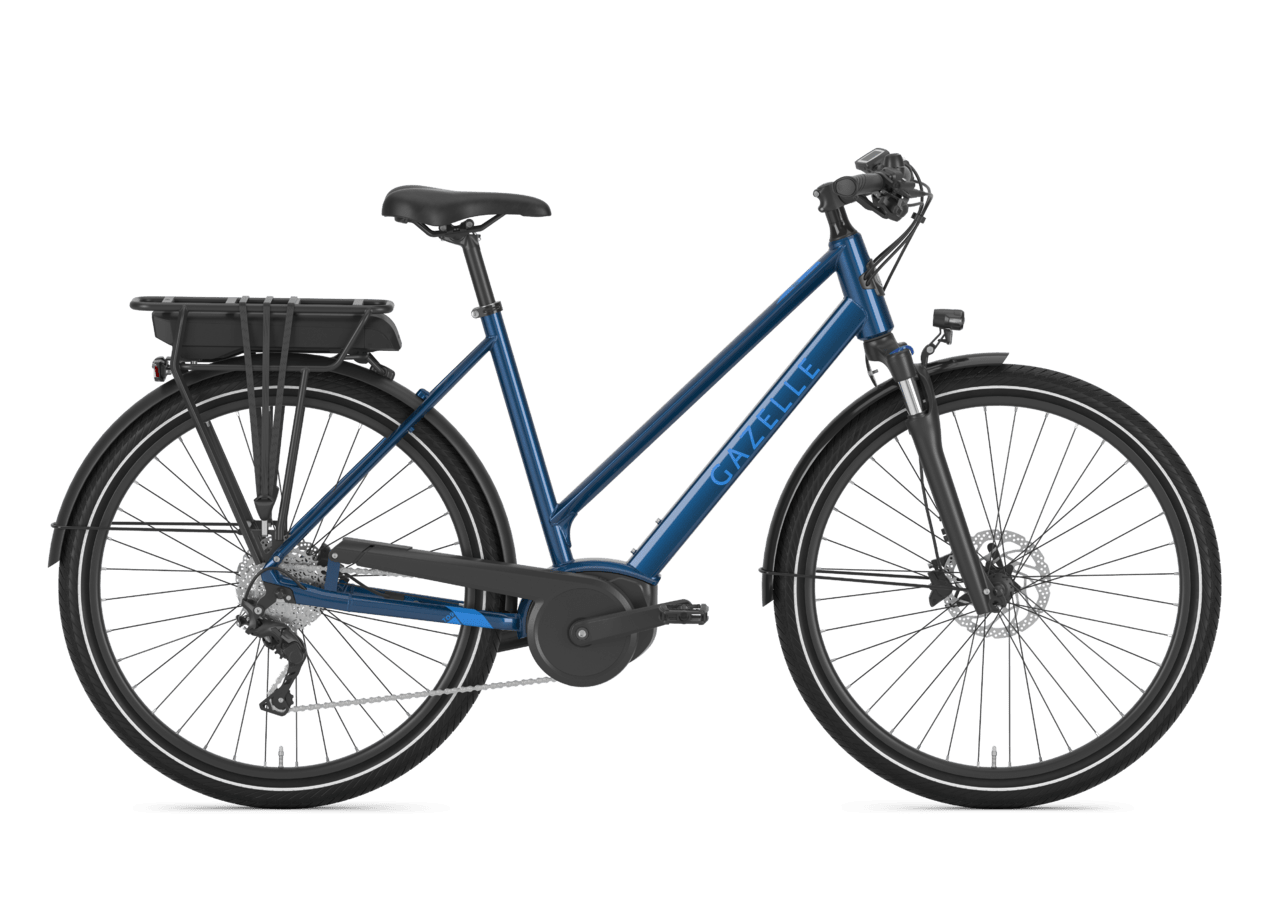 Blue Gazelle electric bicycle with a rear cargo rack, disc brakes, and black tires against a transparent background.