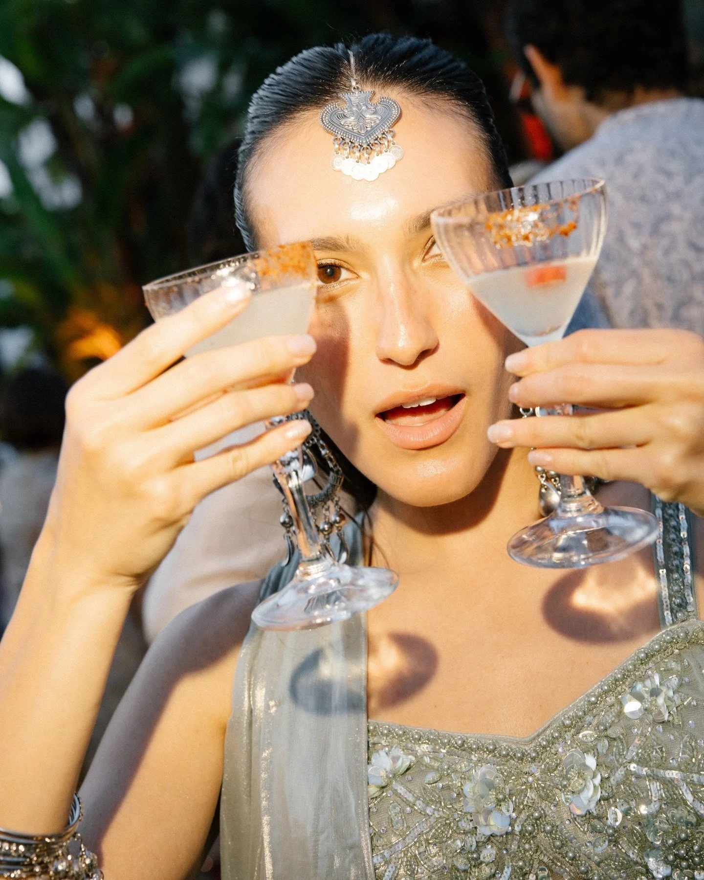 Glasses up.
A toast, and the night opens.