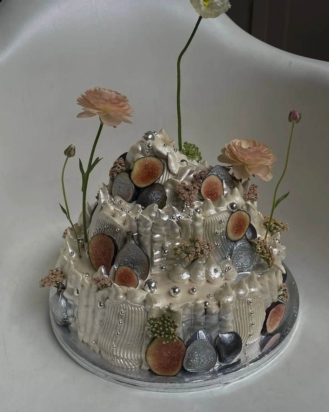 This whimsical cake trend has been with us for a while - and we still love it.
This year, it&rsquo;s all about the finish: lunar tones, soft shimmer and a touch of stardust magic.
