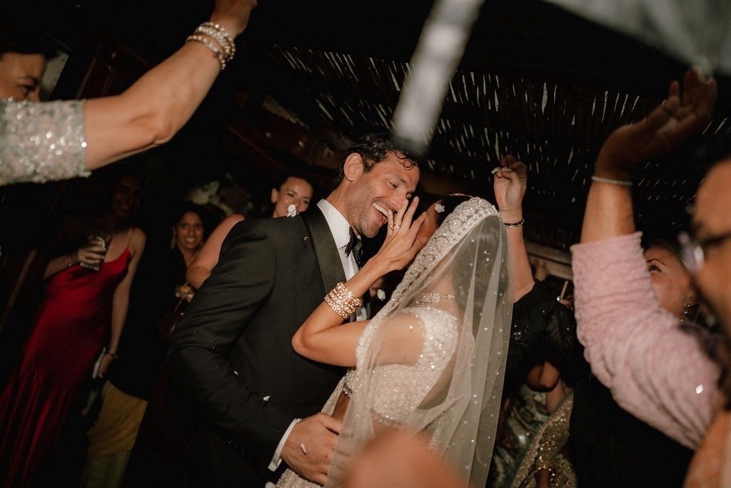 Some weddings are remembered for the perfection.
Others are remembered for the feeling.

Raina &amp; David&rsquo;s wedding became one of those rare celebrations where nothing could dim the joy in the air - not even the Ibiza skies opening above us. B