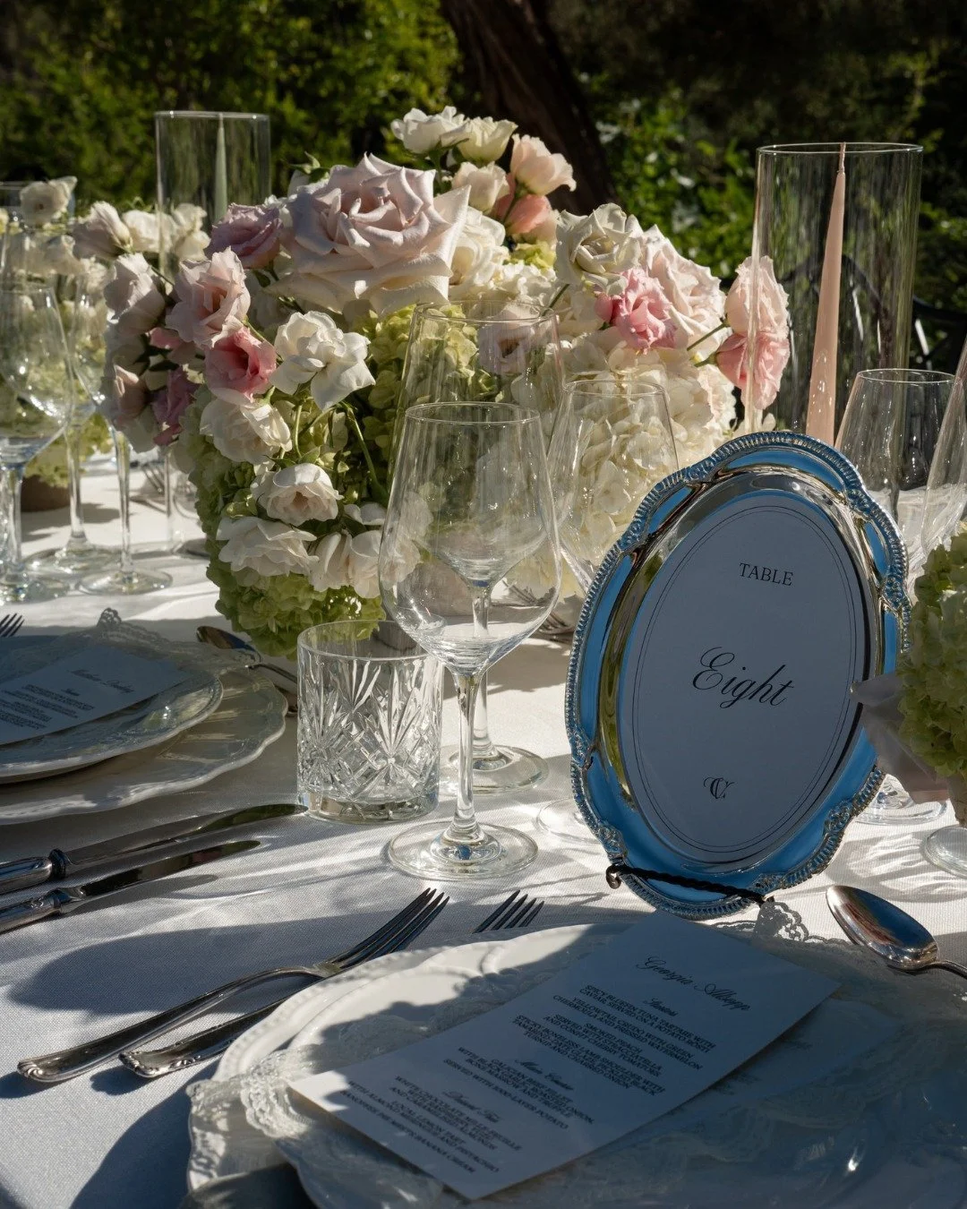 A wedding day is built on hundreds of tiny details.

The handwritten menus waiting at every place setting. The silver catching the afternoon light. The flowers chosen stem by stem. The candles lit just before guests arrive. The final touches to the c