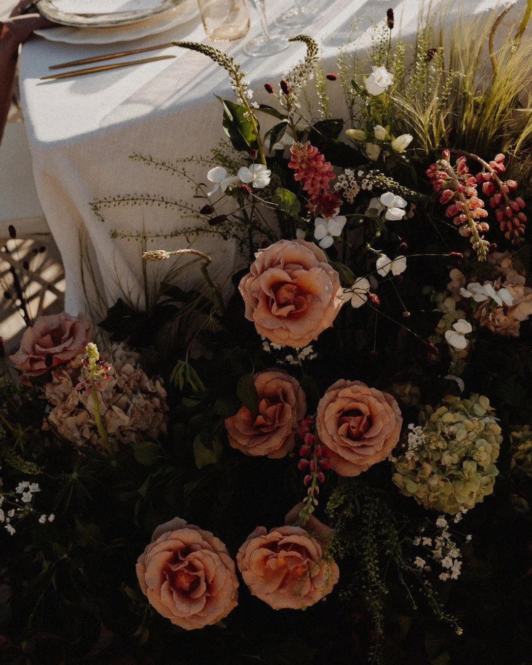 Blousy garden roses, hydrangeas, delicate white blooms and wild grass spilling over the table.
Soft, unruly and just romantic enough.

Wedding Planner @jcbespokeevents
Venue @fincadelicaibiza
Photography @sannelunaphotography
Styling &amp; Design @__