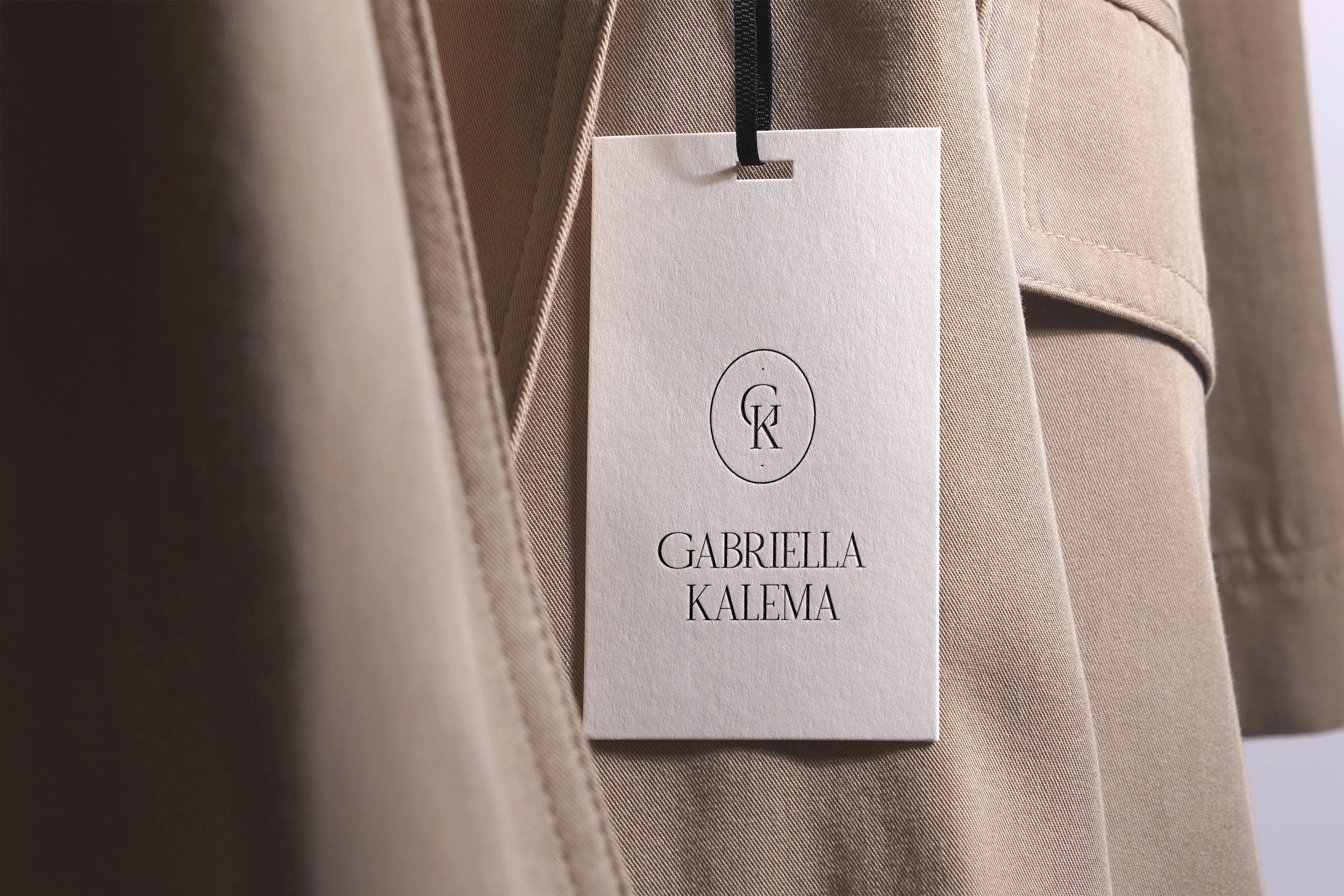 GK - Hang Tag on Coat Mockup copy.jpg