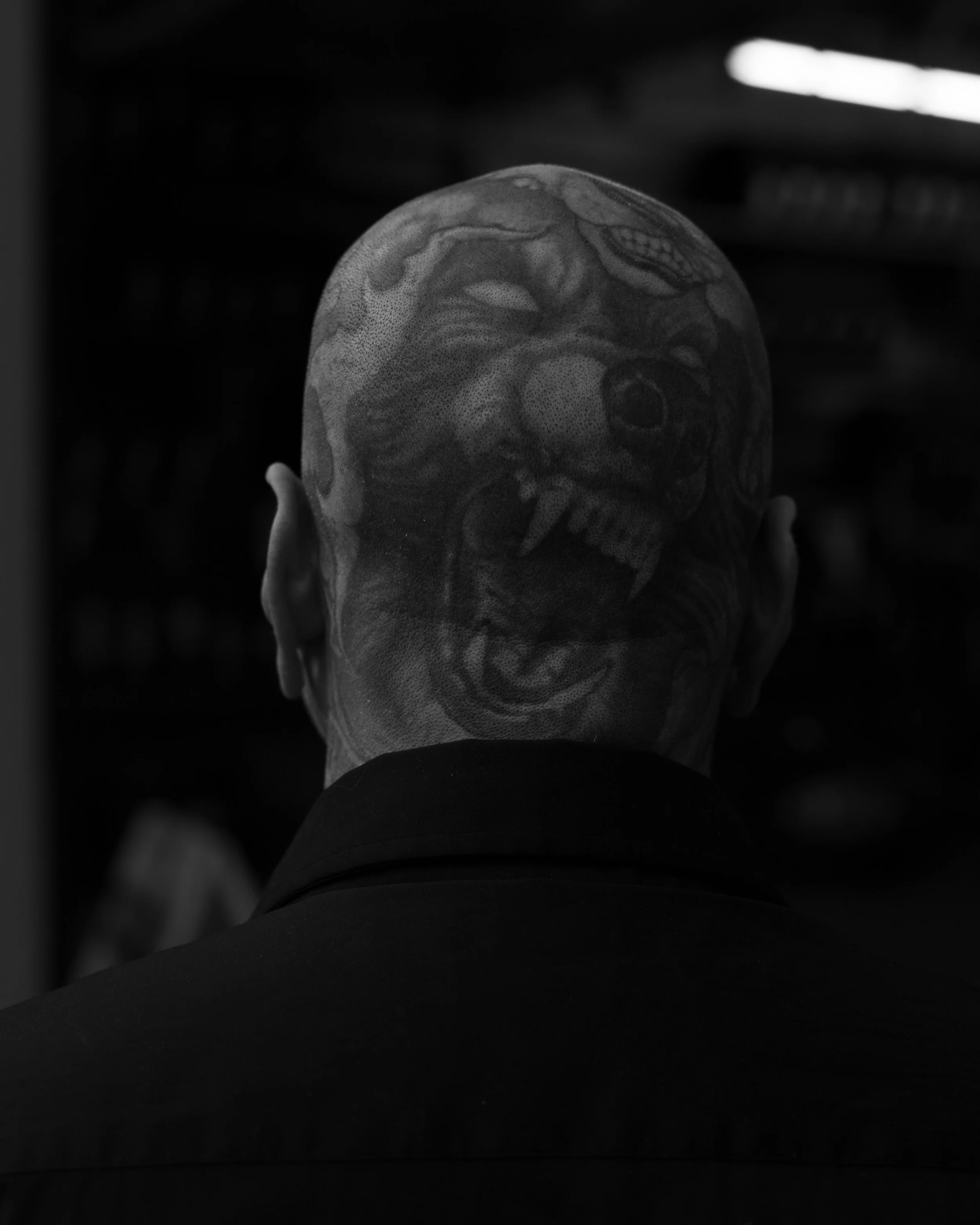 Portrait of a man with a wolf tattoo on the back of his head taken in Sacramento, CA by Kyle Eagling 
