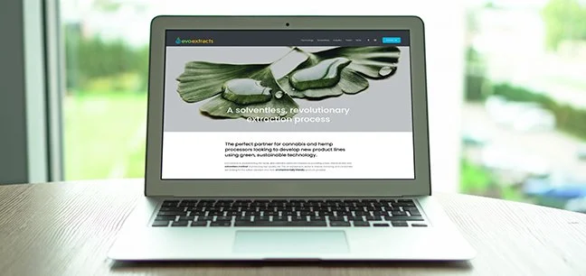 CBP developed EVO brand and web - a solventless extraction process, with a green plant on the screen, on a table near a window.
