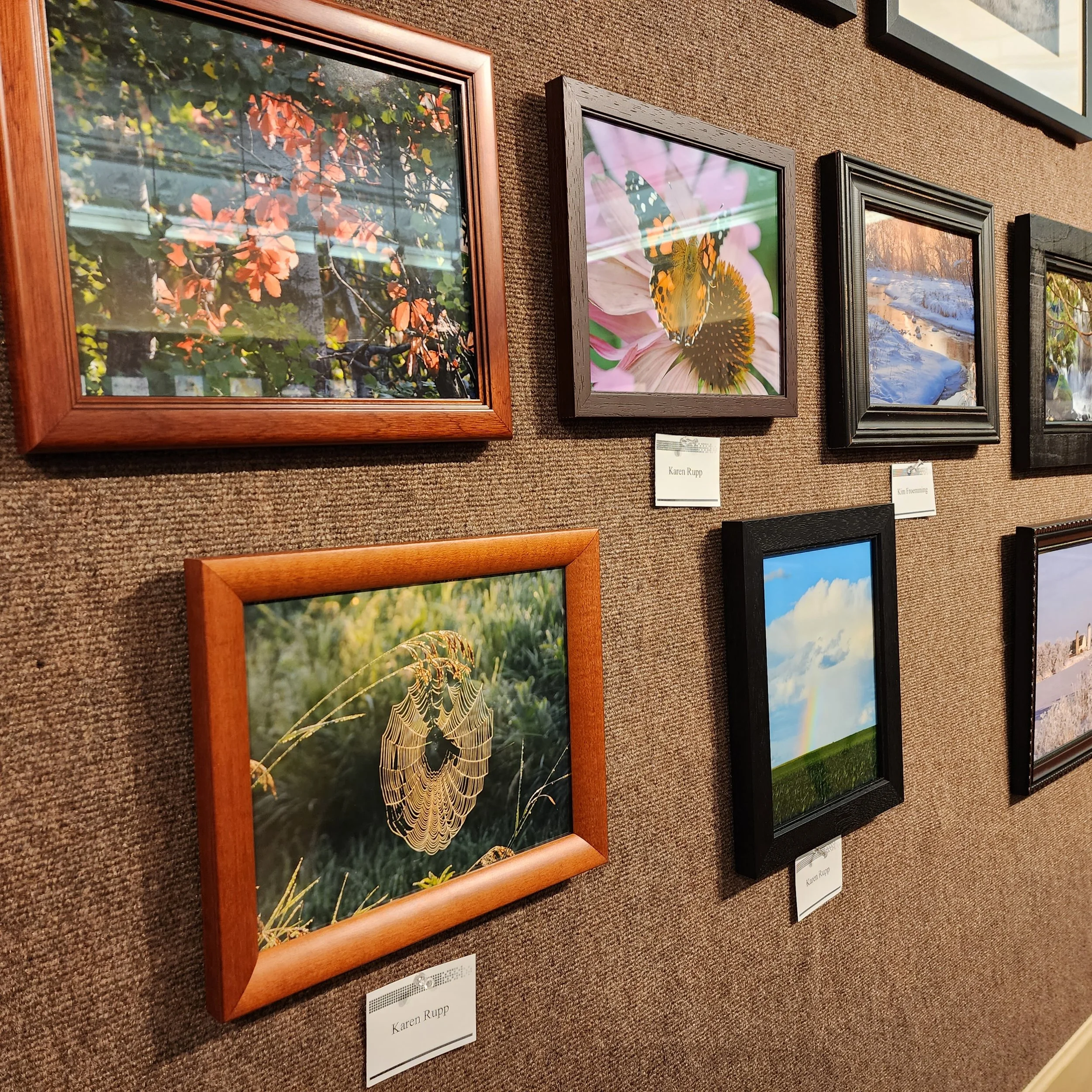 Angled view of framed photographs on a wall