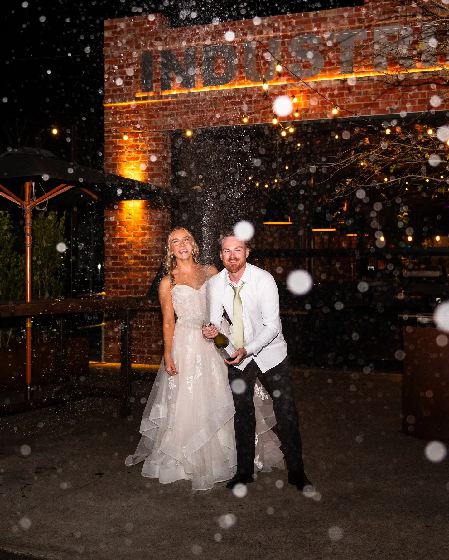 🍾 Laura &amp; Myles absolutely nailing their champagne spray out the front of @industry26cafe 

#geelongwedding #geelongweddings #geelongweddingphotographer #geelongphotographer