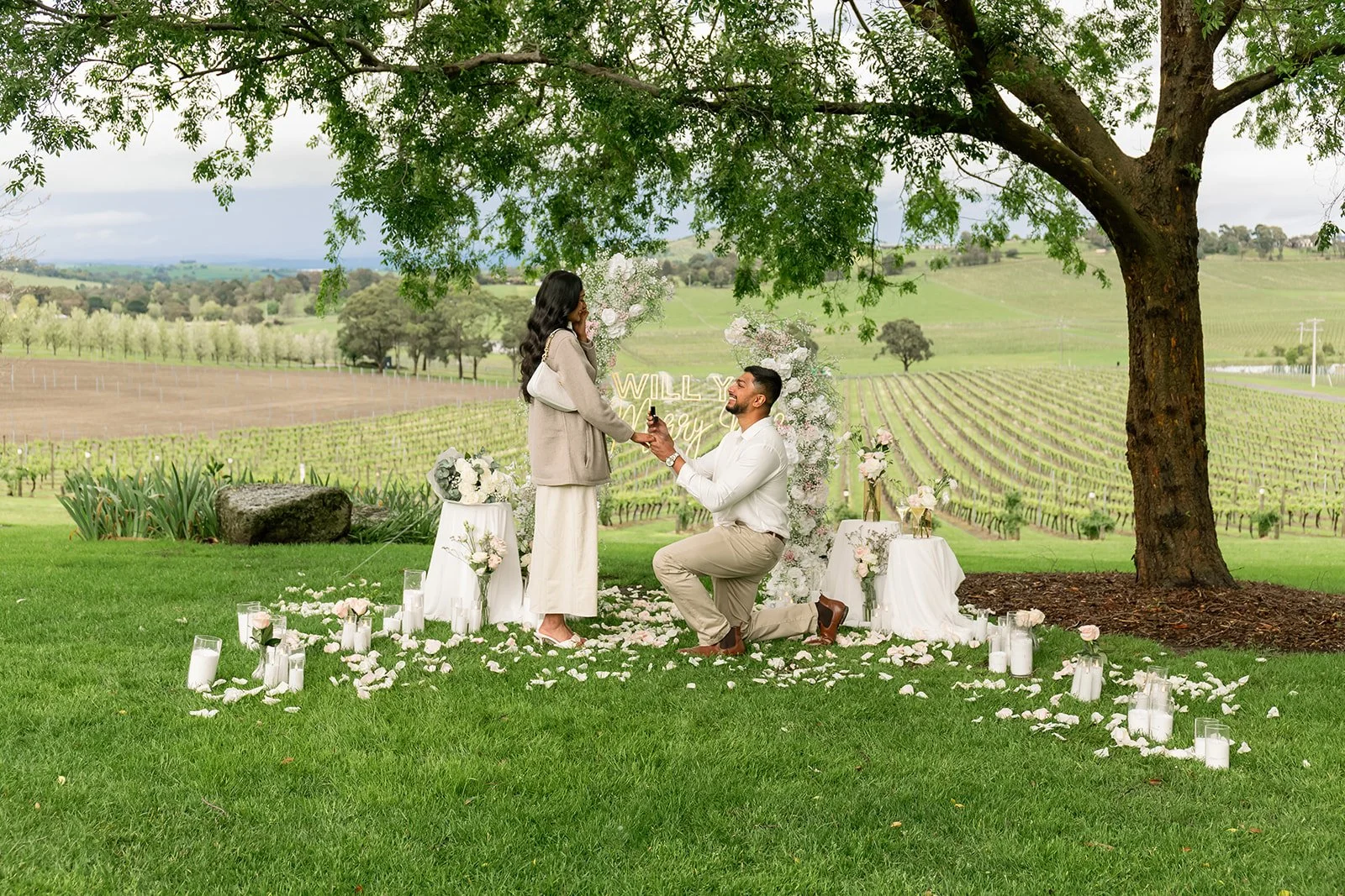 Romantic winery proposal at De Bortoli Wines in the Yarra Valley, Melbourne, featuring an elegant luxury proposal setup surrounded by picturesque vineyards and breathtaking countryside views.