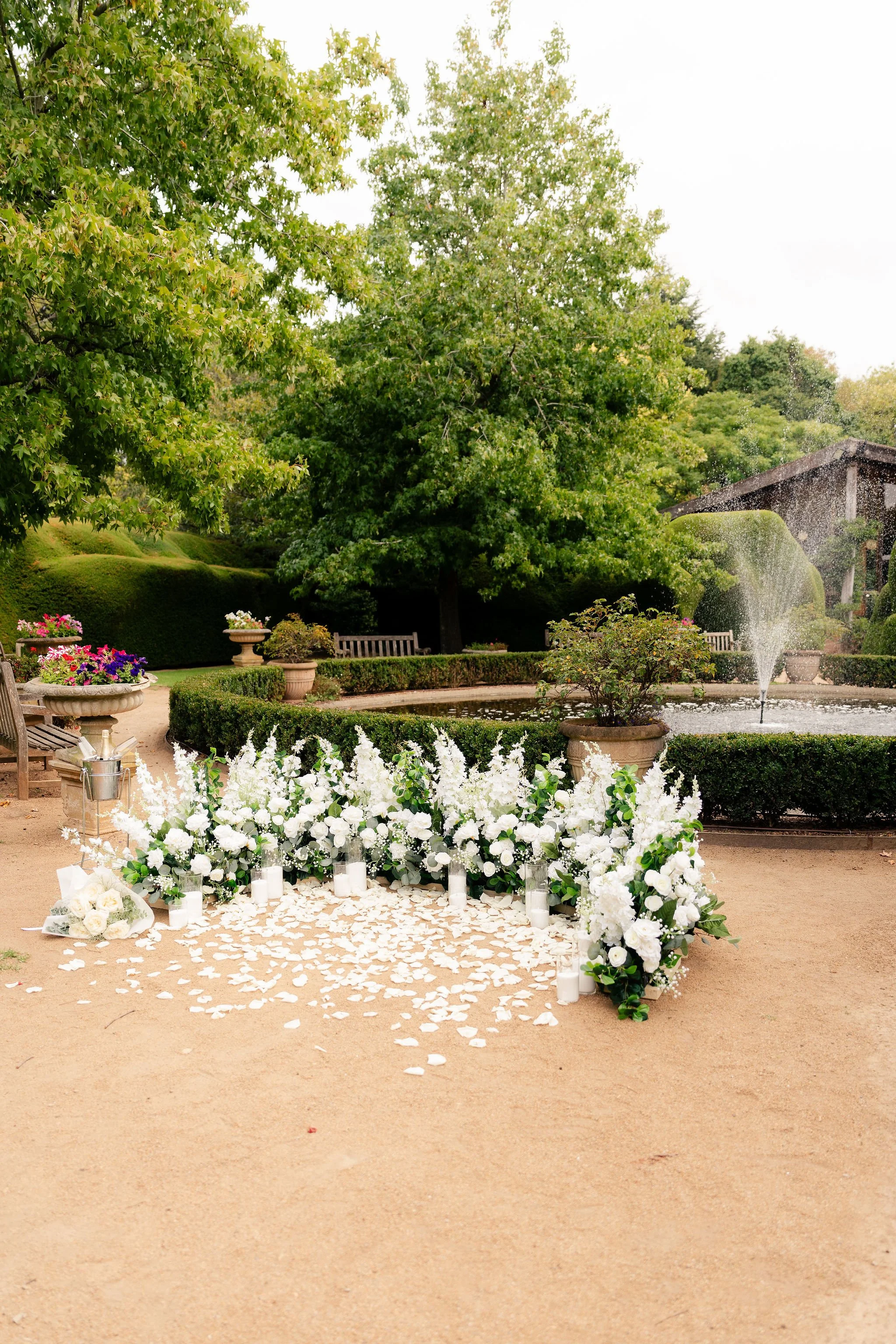 Luxury White Halo Floral Set Up for a Proposal in a garden
