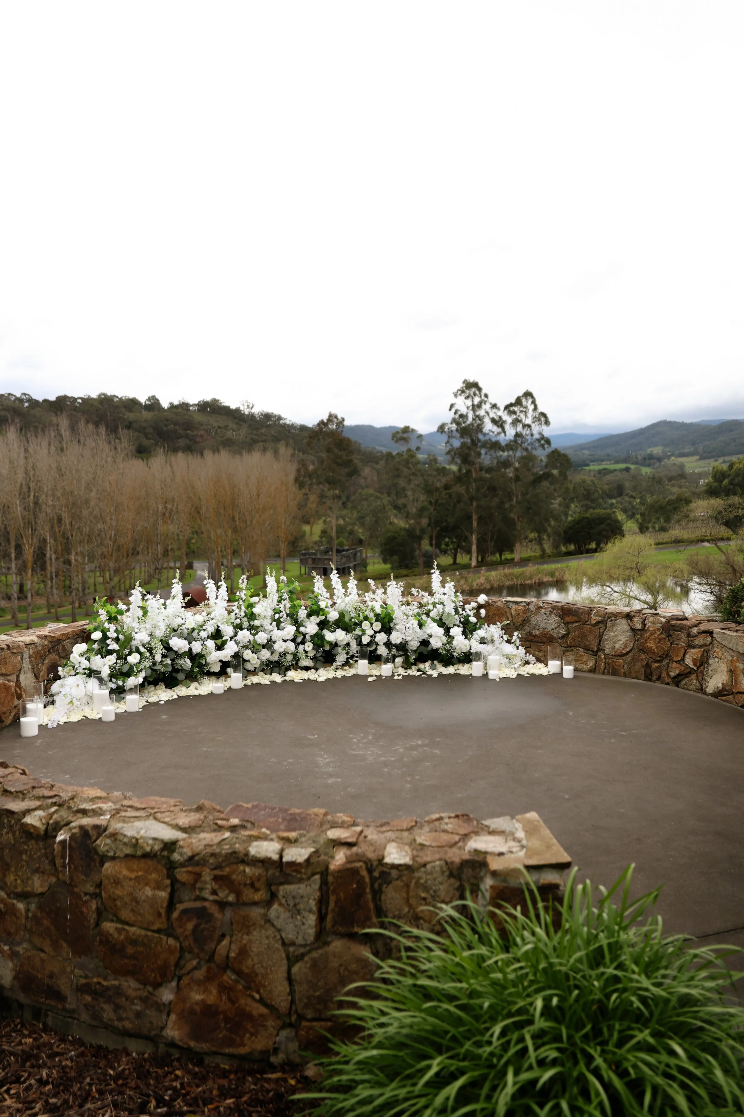 Romantic winery proposal at TarraWarra Estate in Melbourne’s Yarra Valley, featuring elegant proposal styling surrounded by rolling vineyards, breathtaking countryside views and a stunning luxury winery setting.