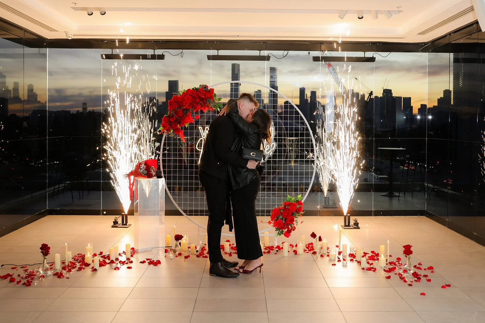 Romantic Rooftop Proposal with fireworks by proposal photographer