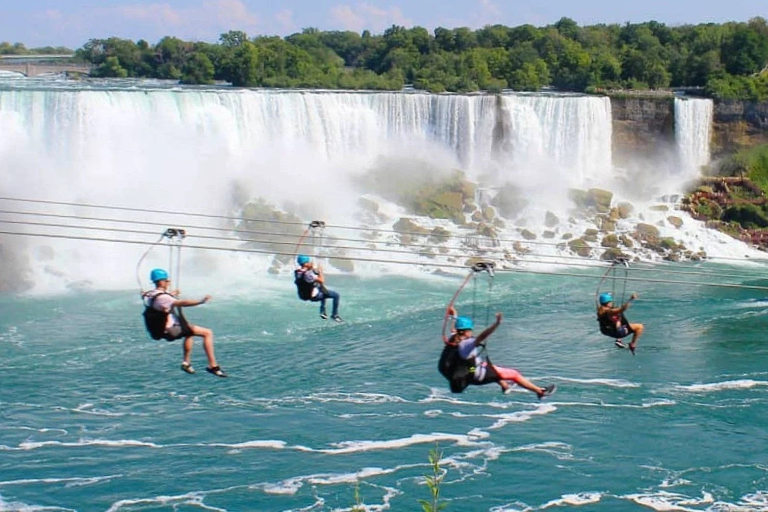 Group of guests ziplining at WildPlay in Niagara Falls, Ontario.