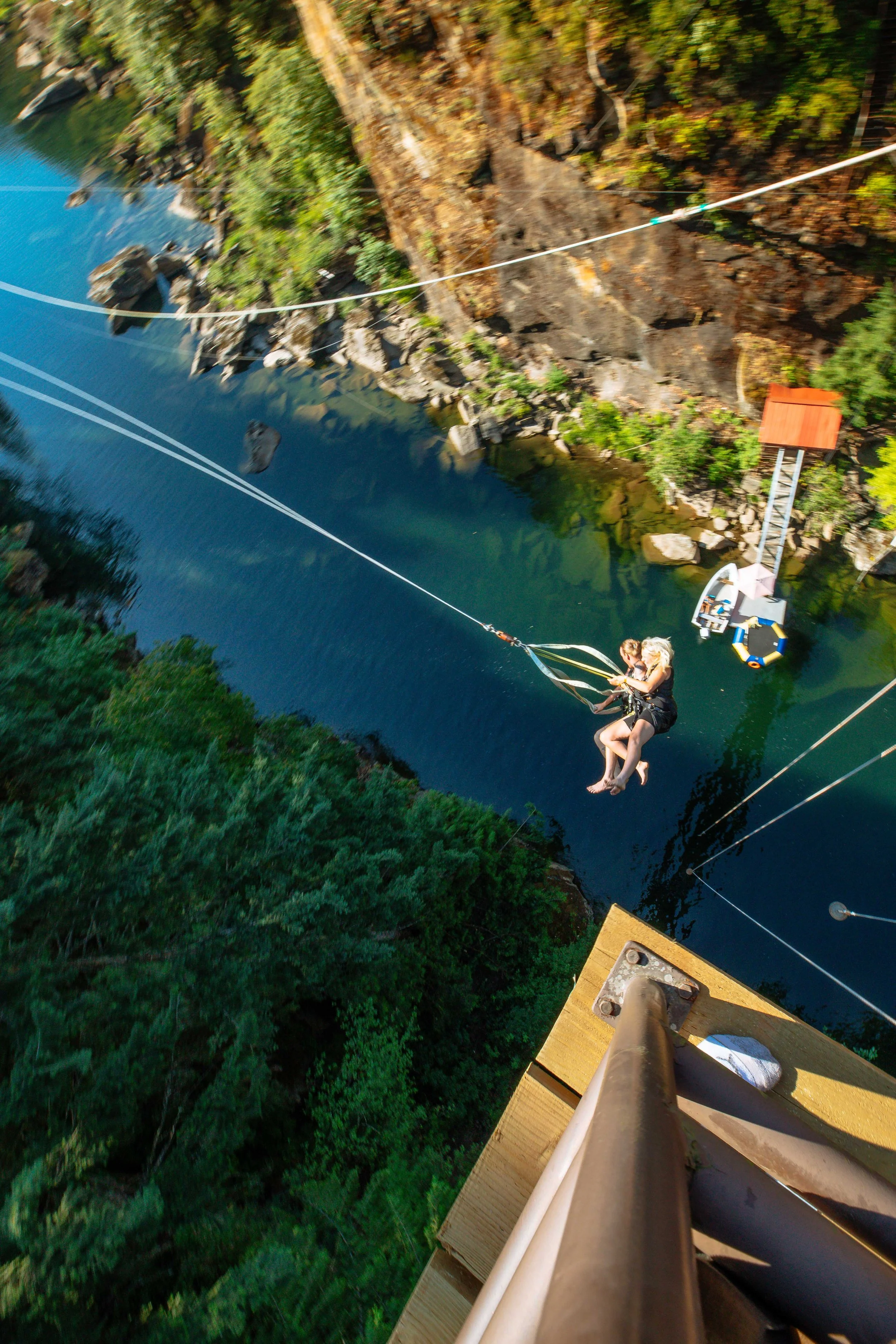Two guests on the Primal Swing freefall drop over the Nanaimo River at WildPlay in Nanaimo, British Columbia.