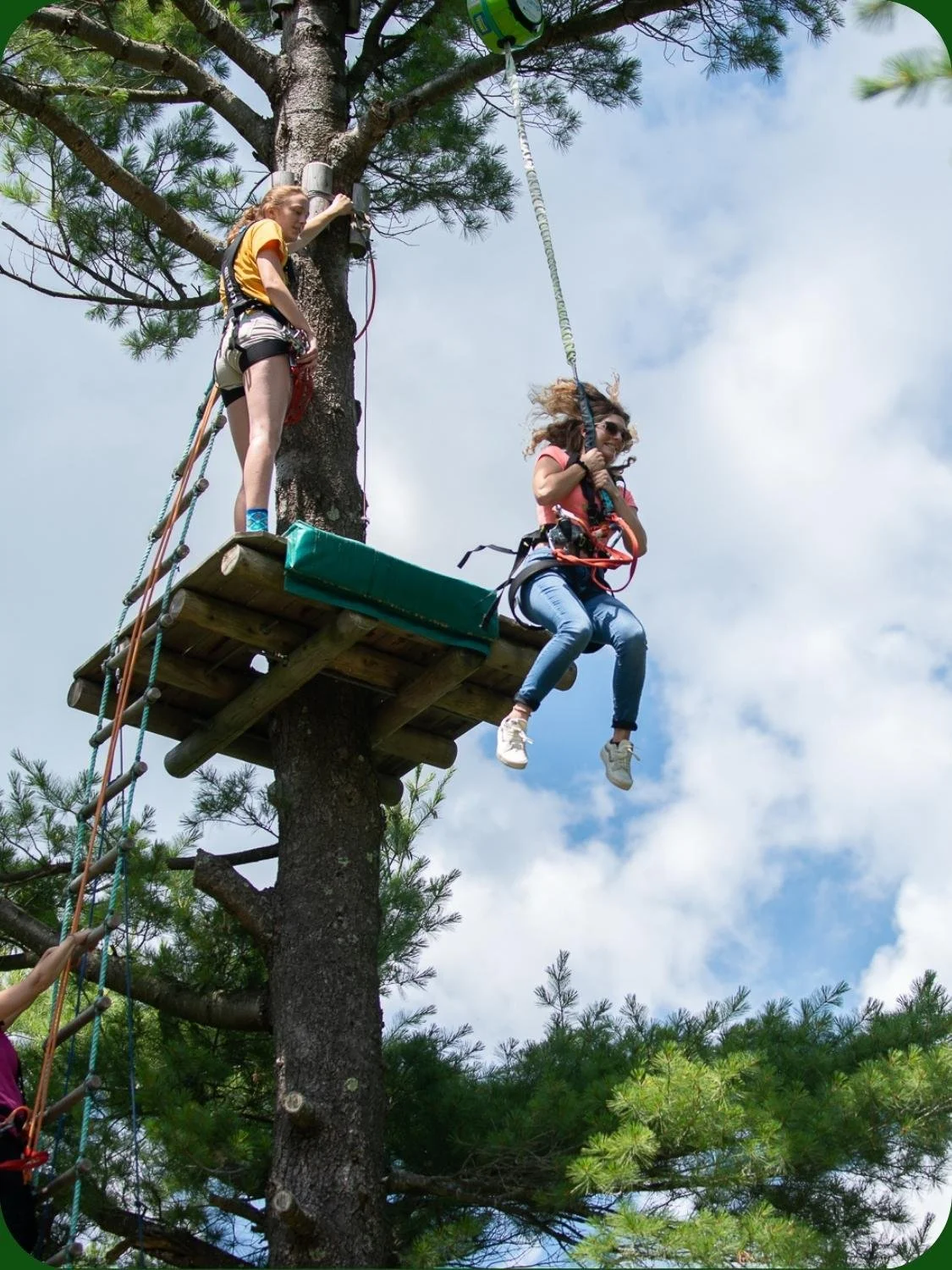 Guest taking a 40ft plunge from a platform at WildPlay outdoor adventure park. 