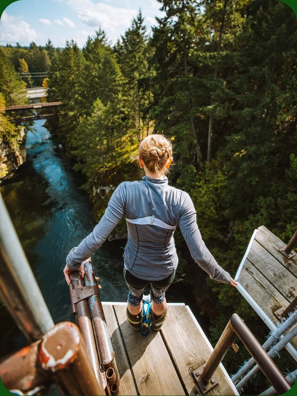 Guest preparing to bungy jump overlooking the Nanaimo River at WildPlay Nanaimo, British Columbia.