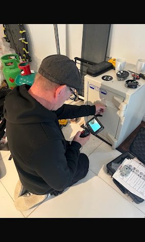 Engineer opeing a Safe at Safebsusters
