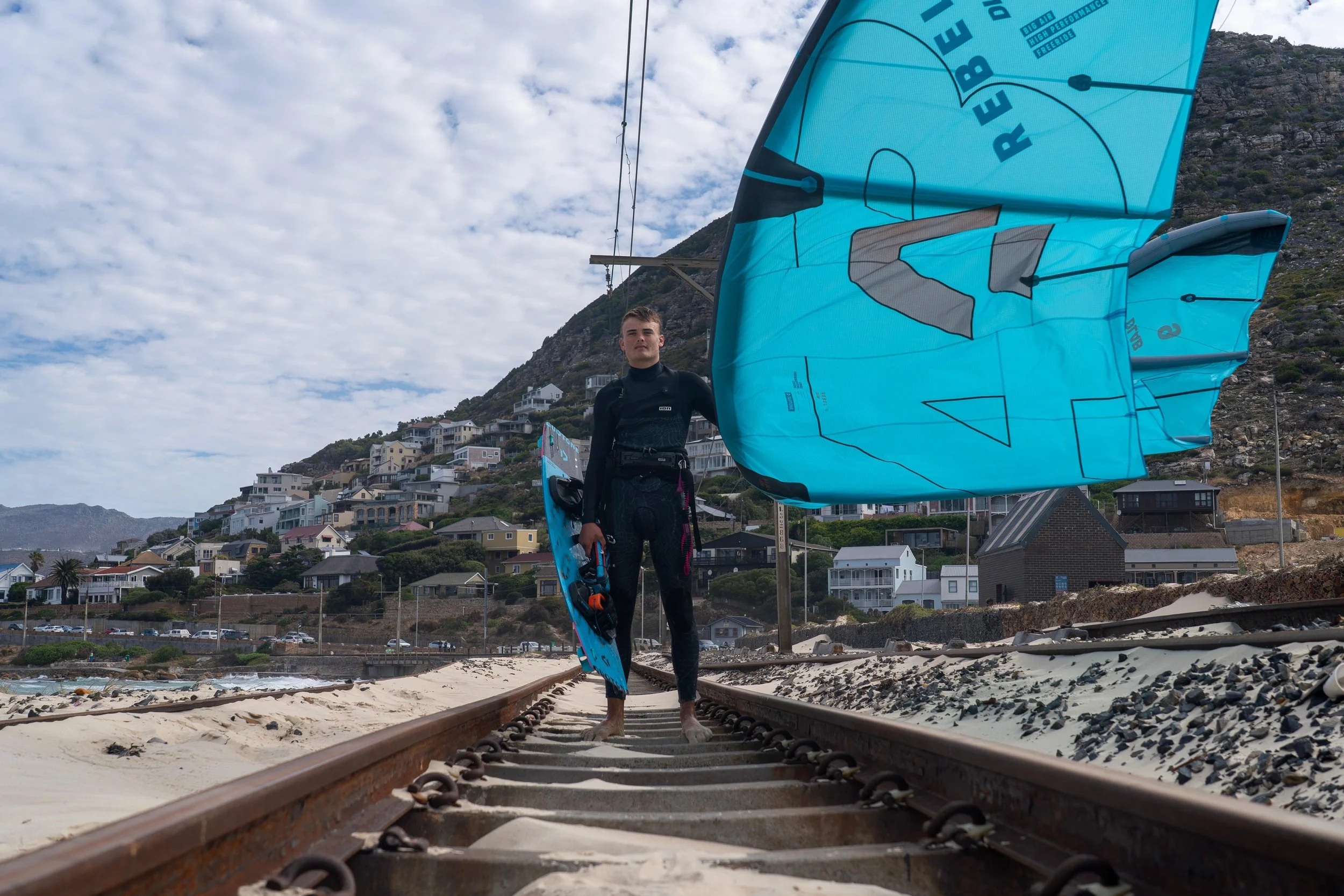 Max Tullett kitesurfer on the railway at Glencairn kitespot