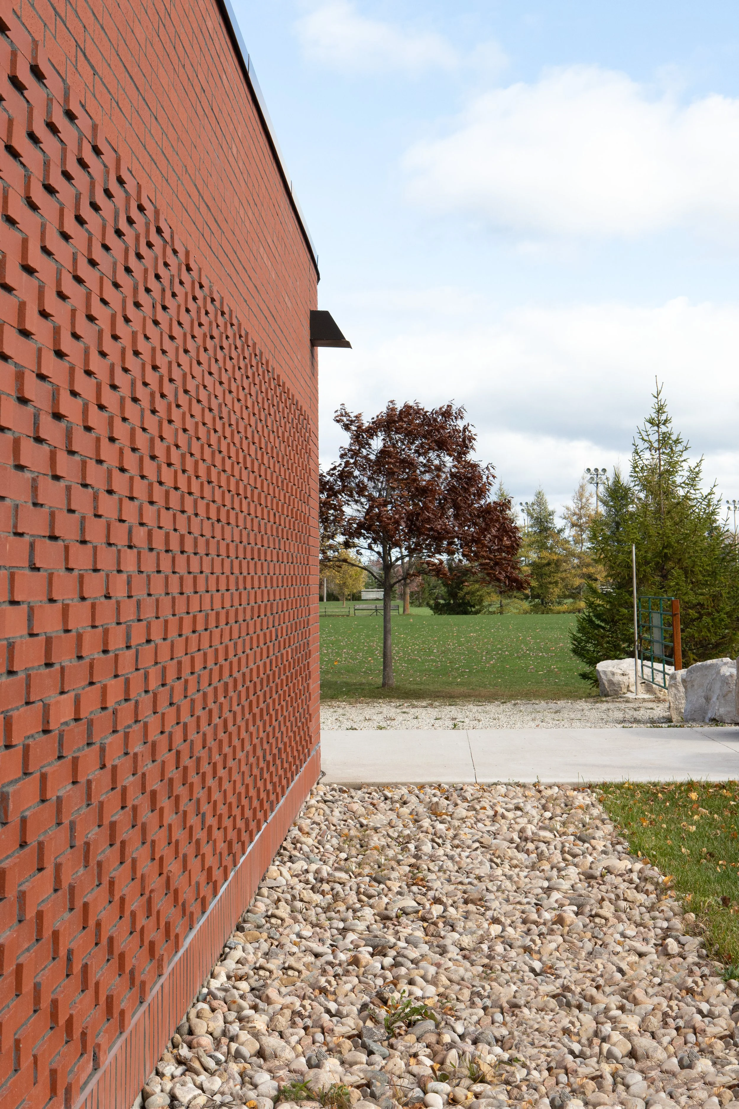 Exterior brick facade of Fisher Field Soccer Clubhouse designed by SOCA. Photography credits to Jessie Lau