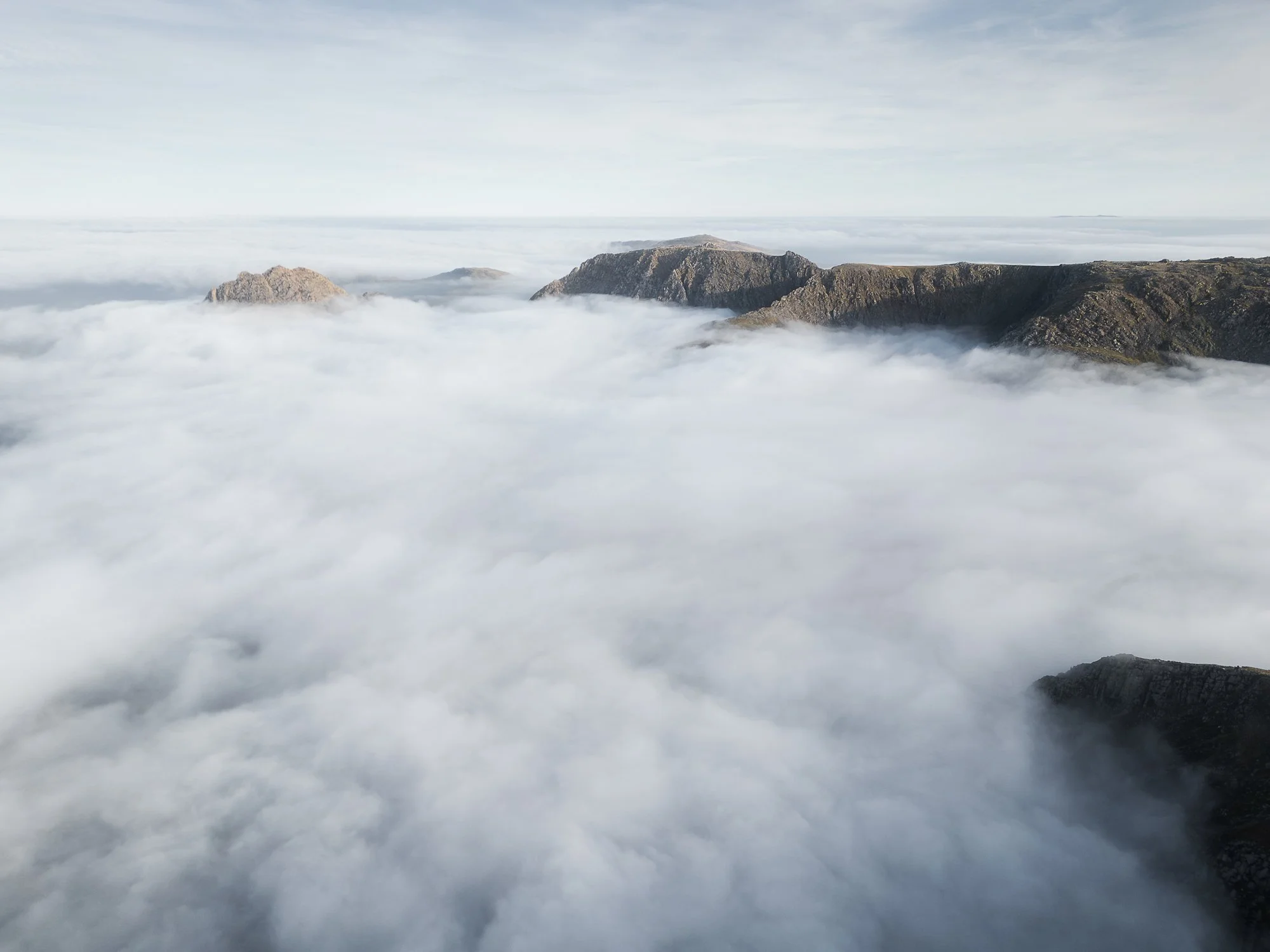 A drone photo looking down the Ogwen Valley during a cloud inversion in Snowdonia taken by Trevor Sherwin Photography