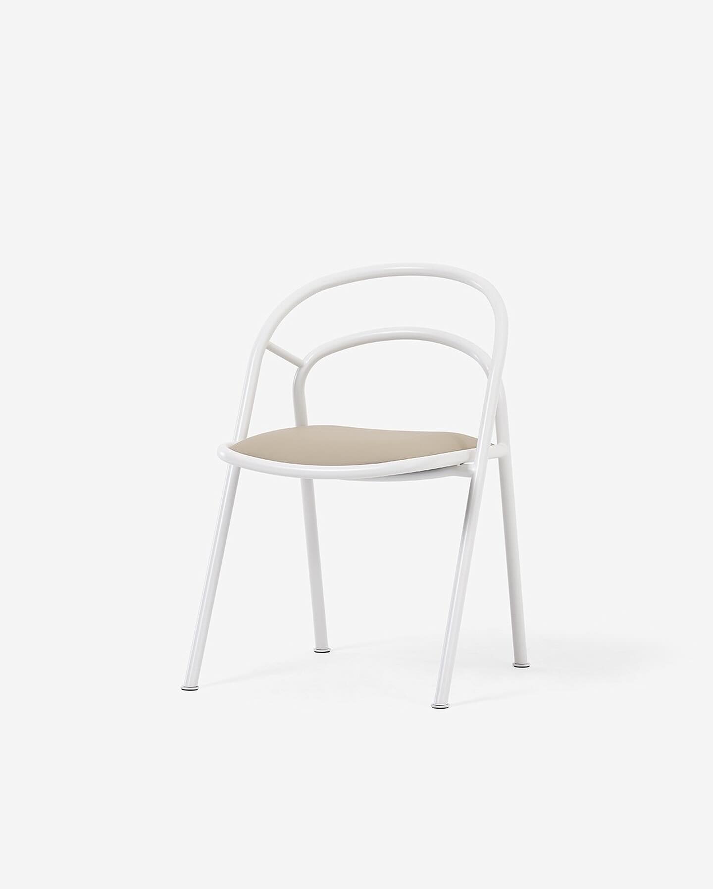 Introducing the Inn chair, a contemporary interpretation of the timeless French bistro chair. With its distinctive curved open back frame, available in a range of captivating colors and finishes, the Inn chair effortlessly complements any contemporar