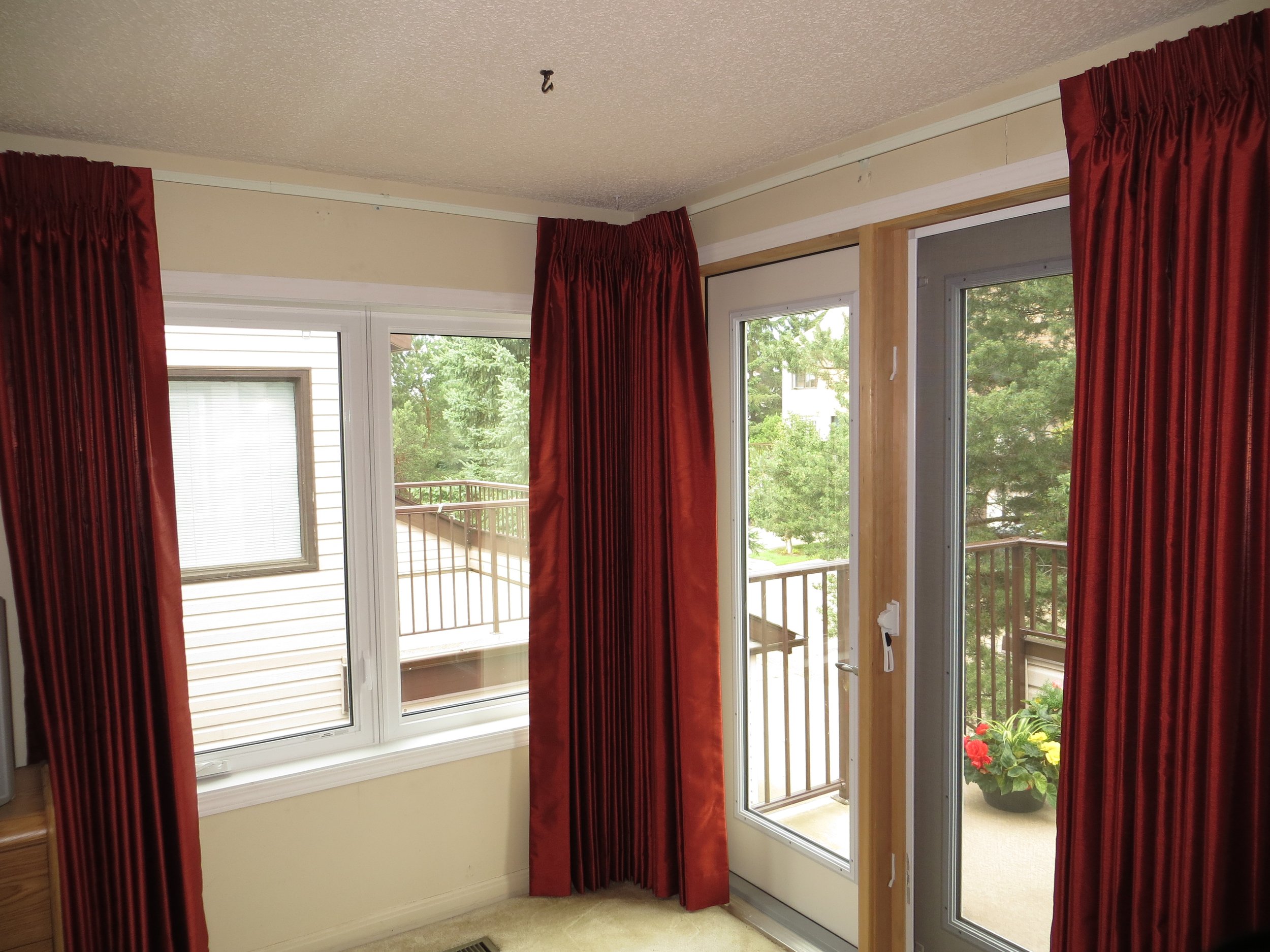 Custom draperies by Fresh Look Design for a primary bedroom in a townhouse.