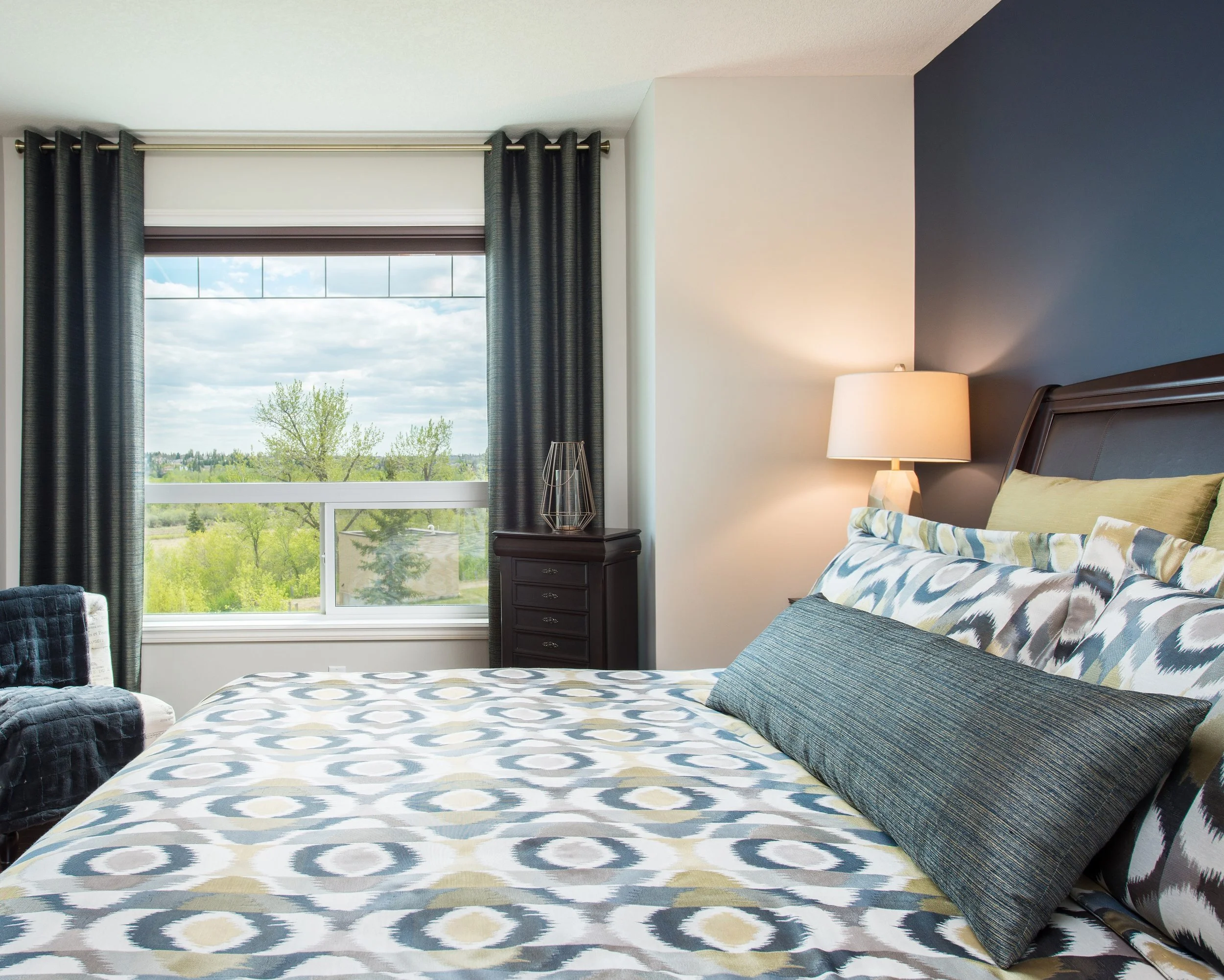 Beautiful Primary Bedroom with Custom Drapery, Bedding and Pillows.
