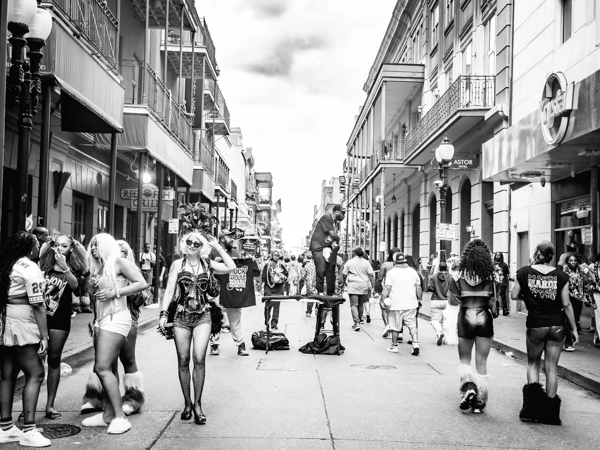 Street vendors, strippers and Mardi Gras revelers in the French Quarter.