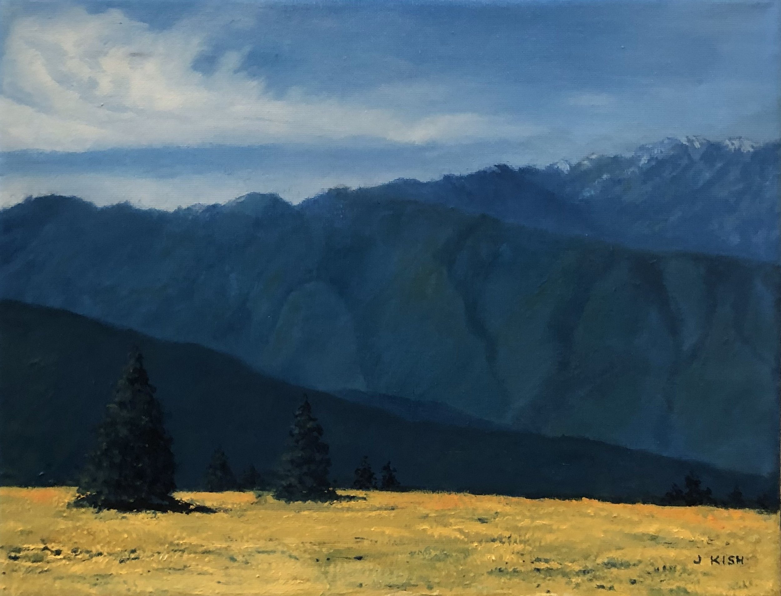 Landscape painting under a soft, cloudy sky.