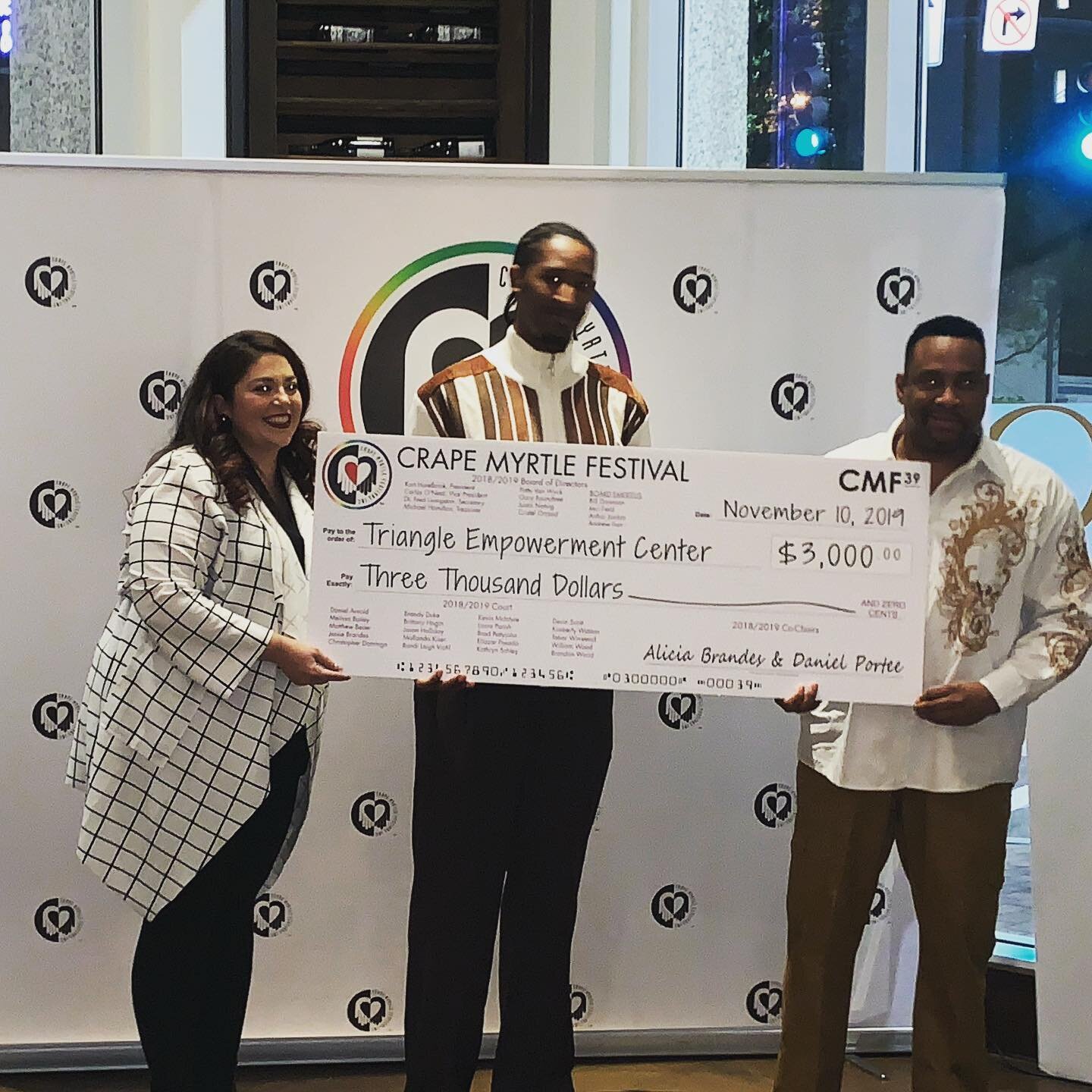 Triangle Empowerment Center check presentation CMF.jpg