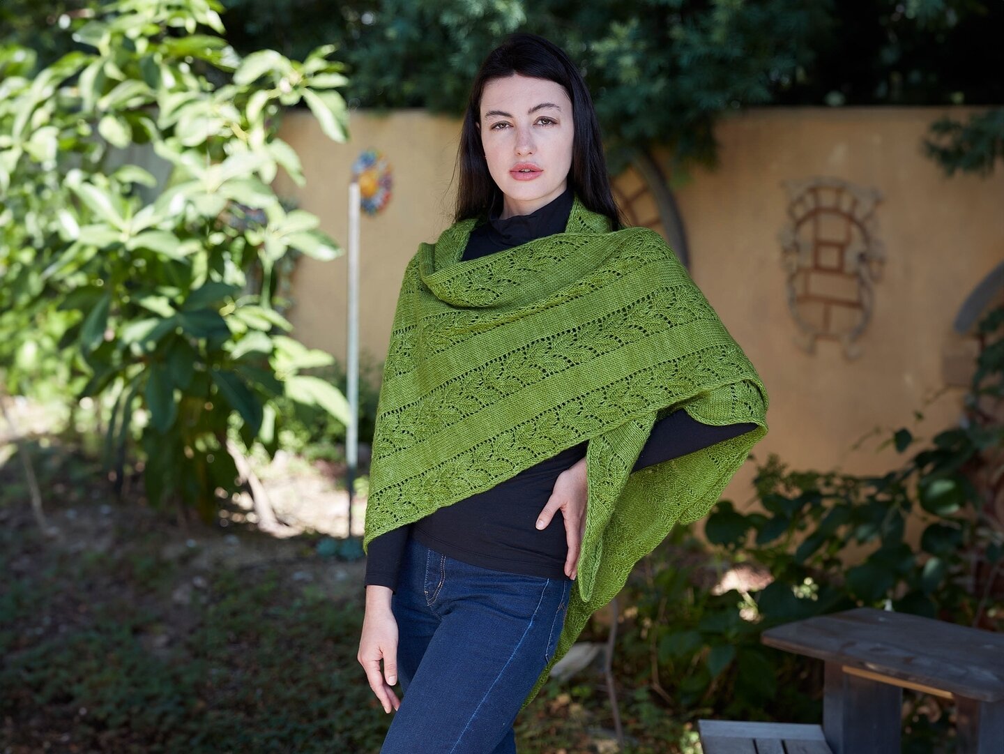 Asymmetrical triangular shawls are one of my favorite shawl shapes to make and wear.

The neck edge of the shawl lies along the knit fabric's bias. Since a fabric's bias is flexible, this makes wrapping the shawl around your neck easy and comfortable