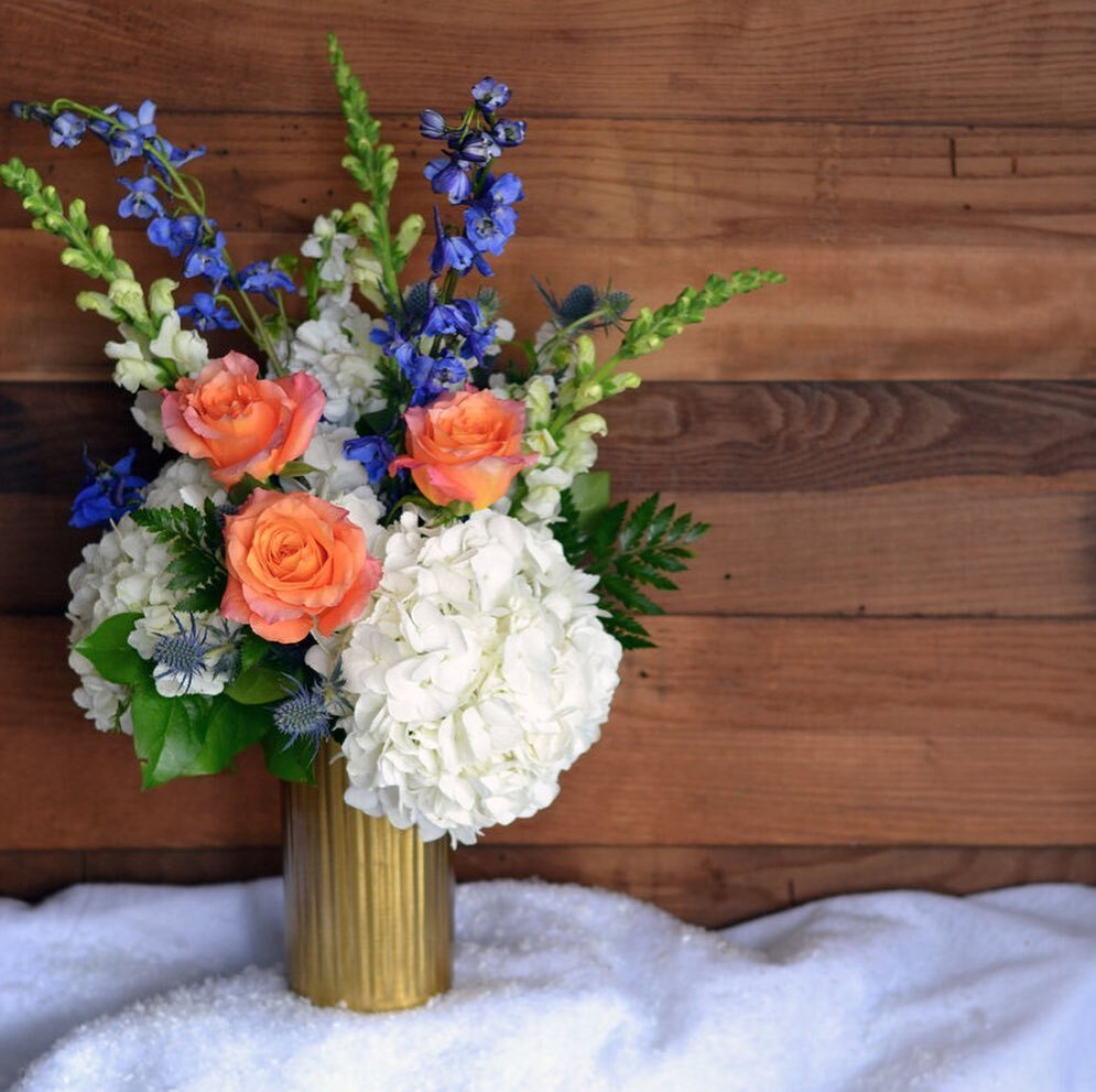 Festival Of Lights Bouquet
Send somebody special this beautiful Hanukkah inspired bouquet. The gold tin vase is filled with Free Spirit roses,  white hydrangeas, white snap dragons, blue delphinium, blue thistle and greens.

https://www.alexandersflo