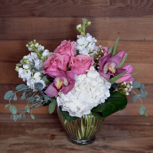 Mom&rsquo;s Favorite! 🌸 
Lovely orchid and rose bouquet in pink &amp; white hues&hellip;Mom will know who sent THESE beautiful flowers!

Cymbidium Orchids, Fresh Pink Roses, White Hydrangeas, White Stock, Wax Flower, Eucalyptus, Seasonal Greens

#Mo