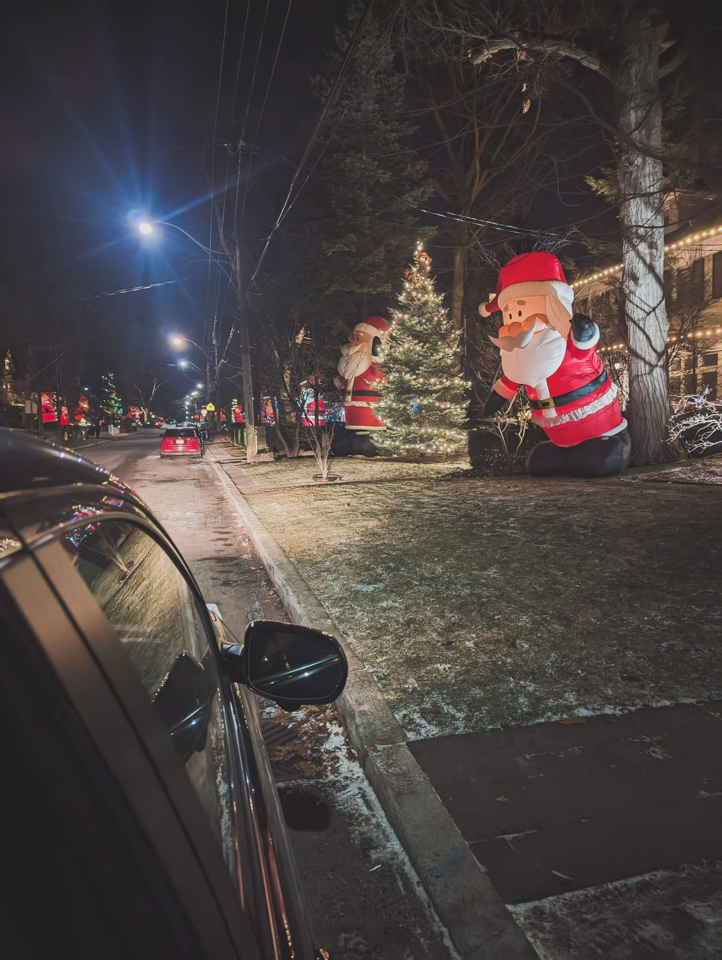  Mom and Dad took me on a little drive to Kringlewood - a street full of giant Santas! 