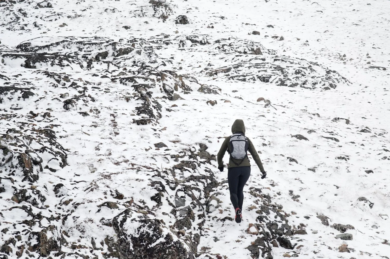 Climbing the snowy rocks at Mount White.