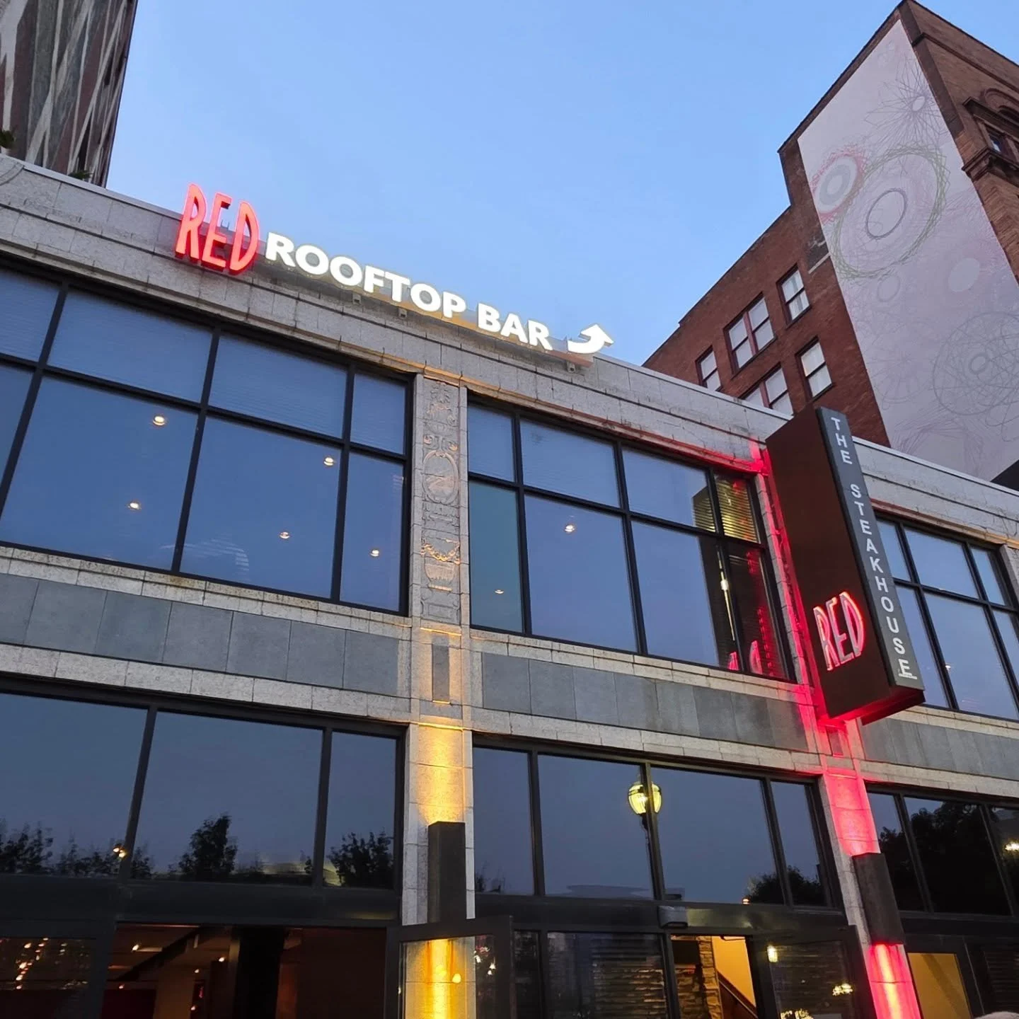 Commercial Lighting job to light up and advertise a rooftop bar. 

Added the option for switches to turn off the "ROOFTOP BAR" wording when patio is closed for the season. With the availability to keep "RED" illuminated for additi