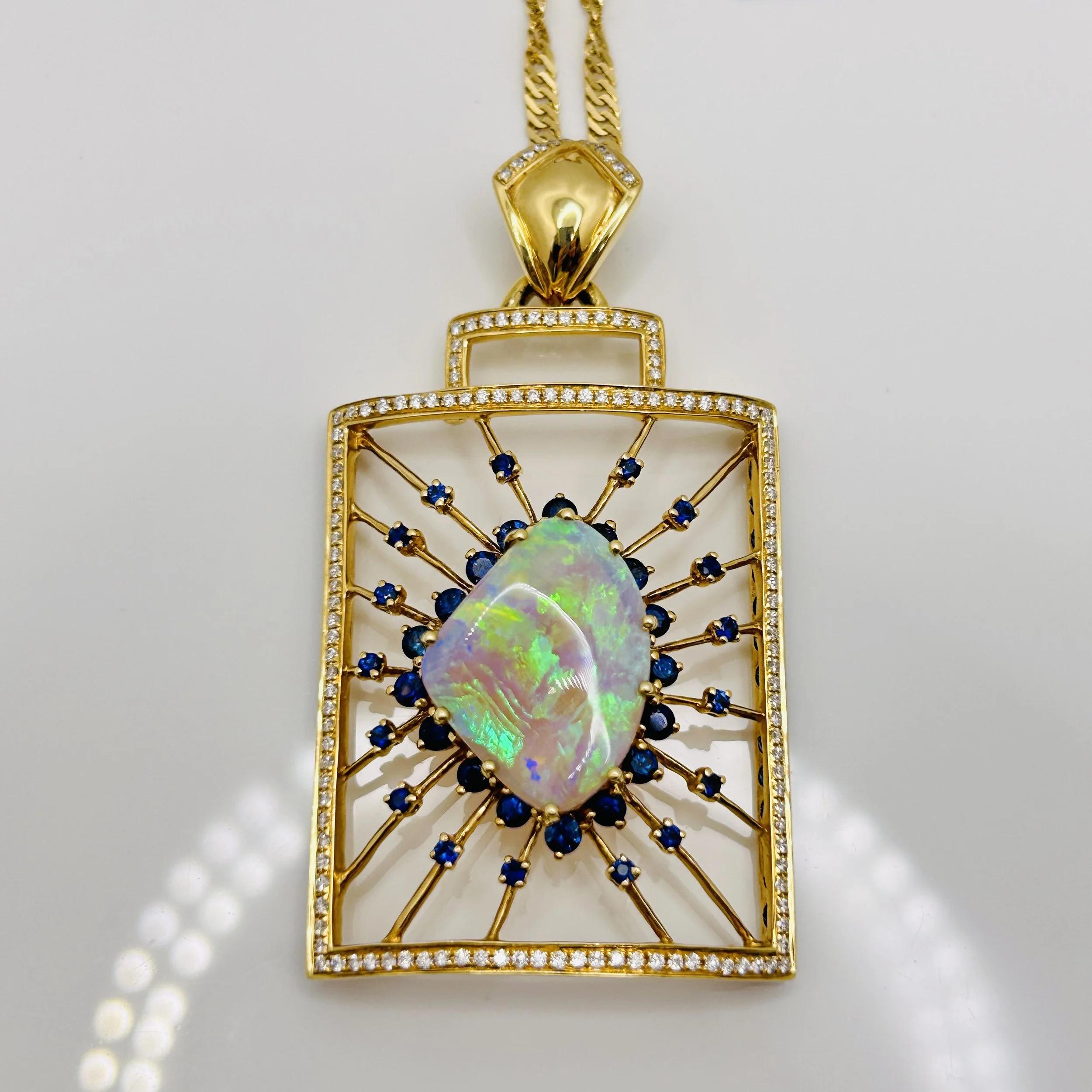 18 Karat Yellow Gold Opal pendant with Sapphire and Diamonds -  HJW006012 #01-1875