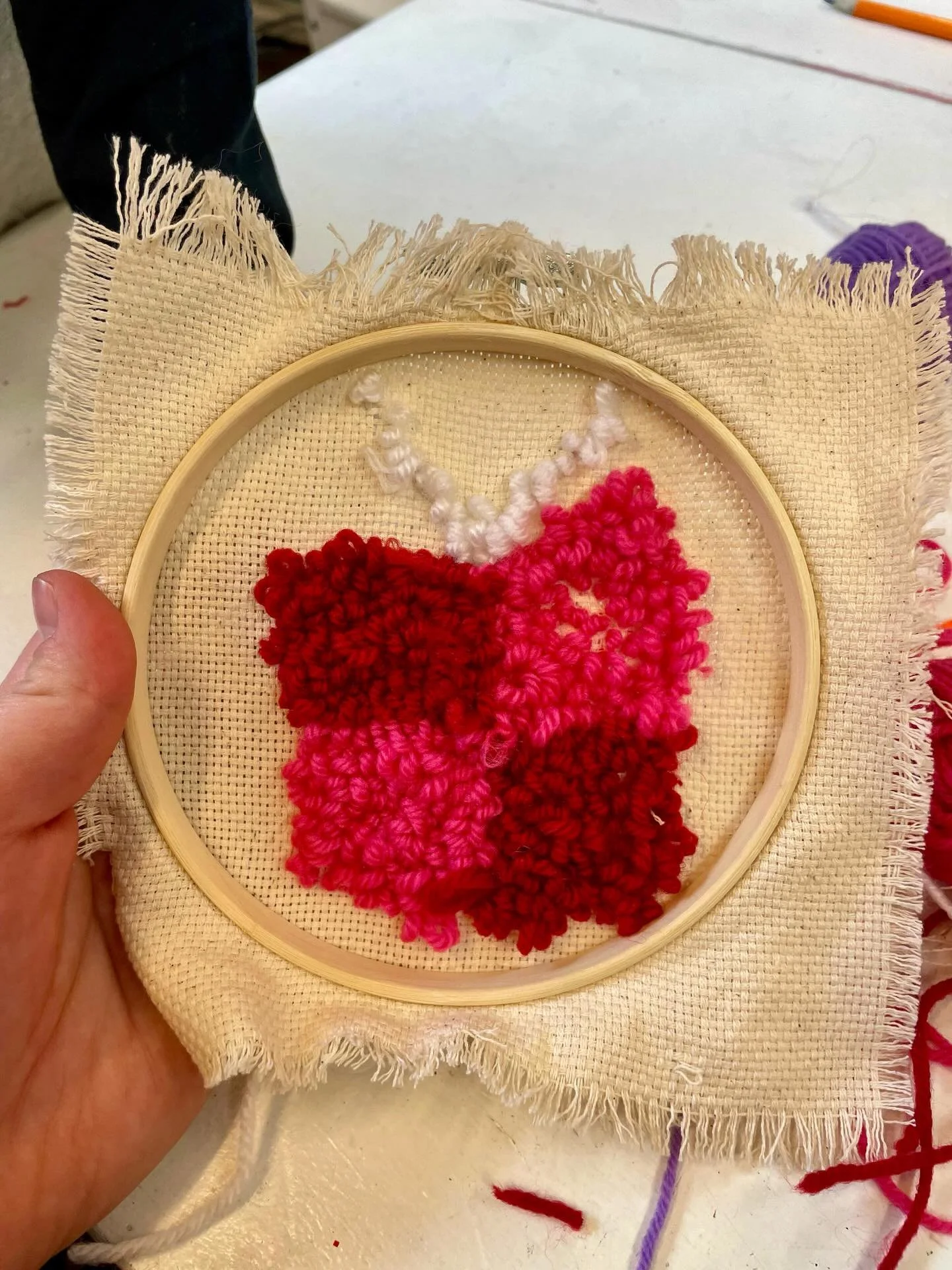 Spring Break Fiber Arts Camp&mdash;halfway through.
The kids have been learning where wool comes from through stories, discussion, and hands-on work. They&rsquo;ve practiced carding raw wool, tried making yarn, and started simple learning booklets to