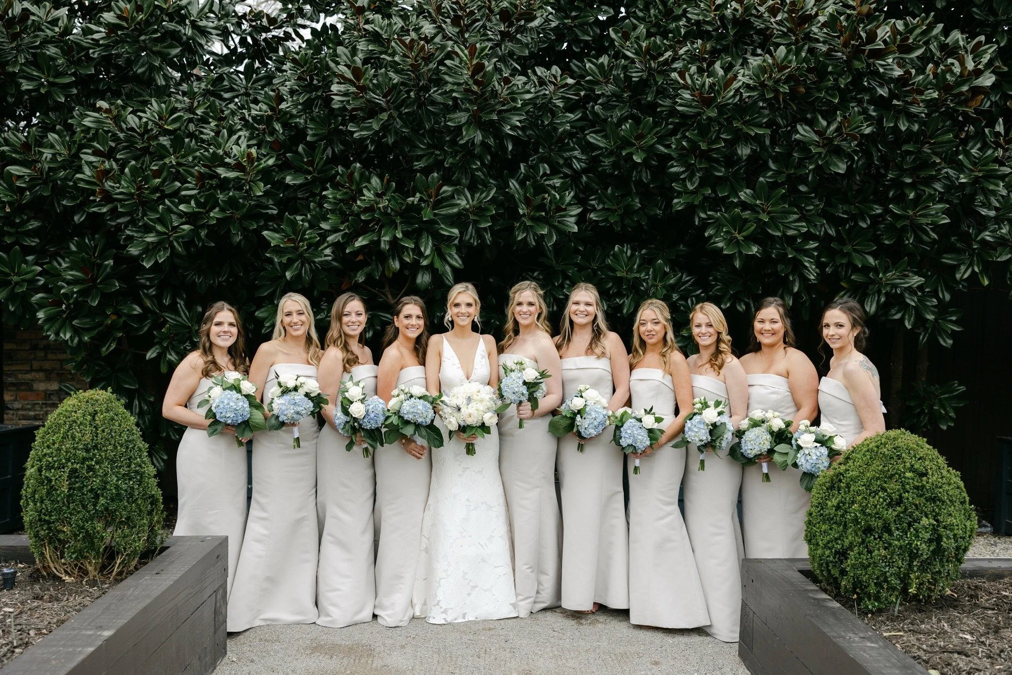 PALMER &amp; JR WEDDING -- an April palette that whispered timeless elegance &mdash; soft dove gray dresses paired with white roses and blue hydrangeas for a look that was effortlessly refined