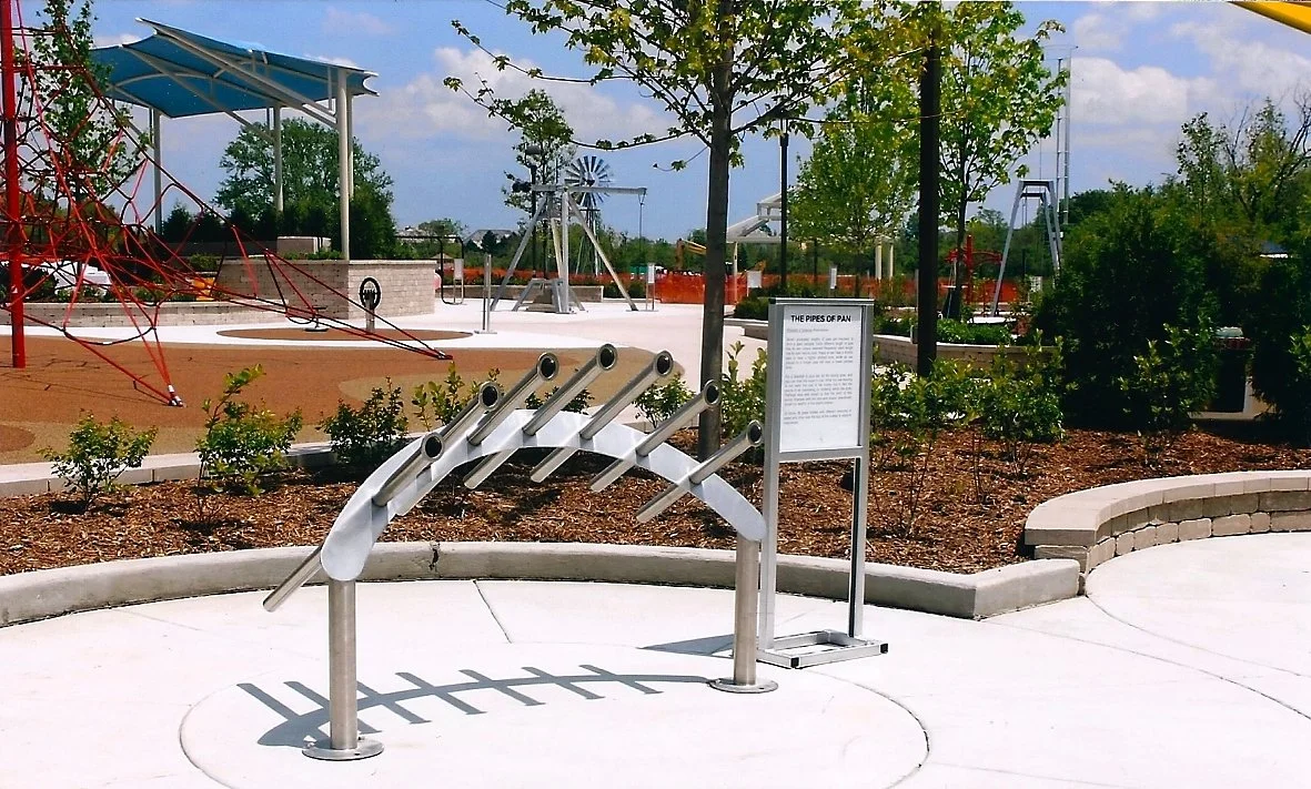 Listening Tubes at The Garoon Gateway to Science in Lake Zurich, Illinois.  Children can place their ear to the ends of the tube, and hear  a specific frequency of ambient sound amplified,  much like listening to a sea shell