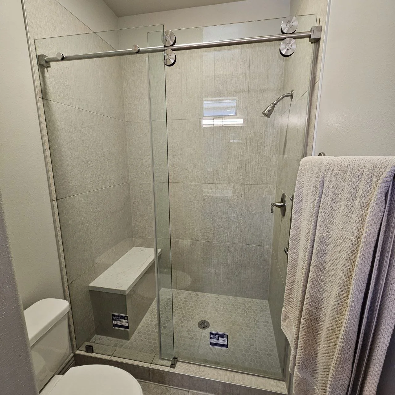 Single sliding door with stationary panel. 3.8TH Clear with enduro shield coating. Brushed stainless hardware.jpg