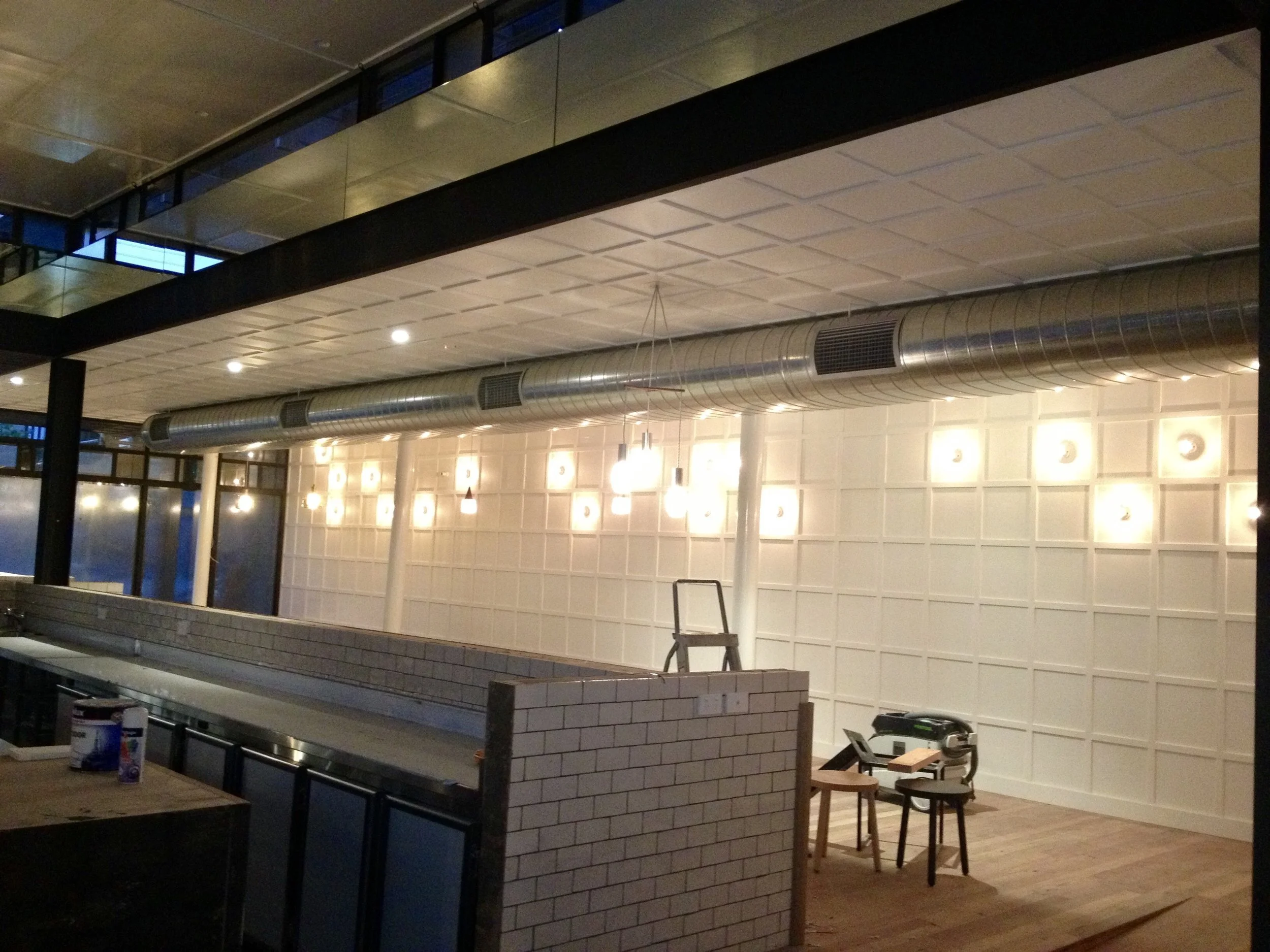 Feature lighting on rear wall at Top Paddock Café.