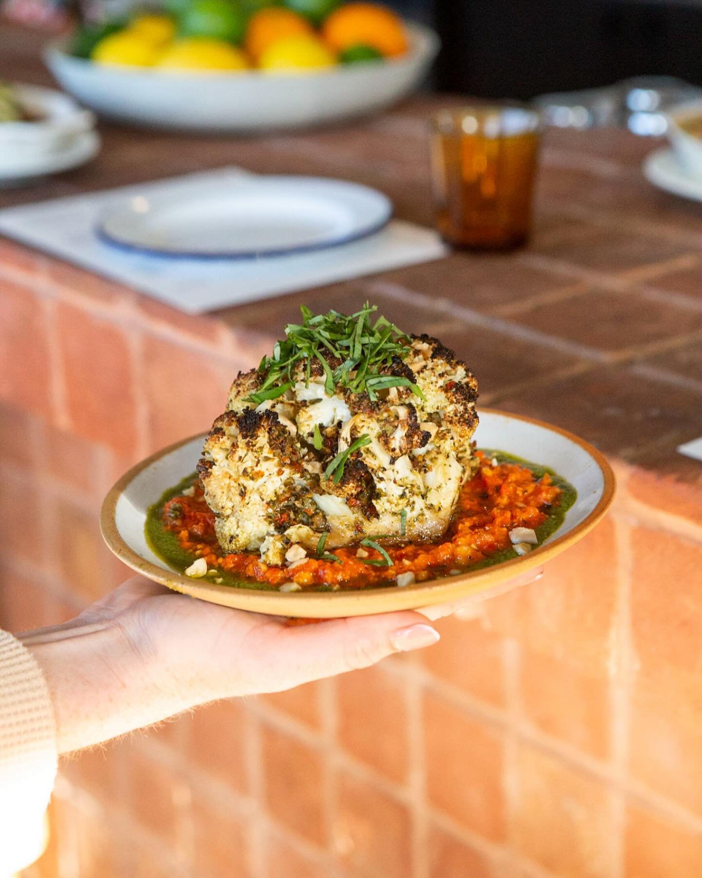 &bull;just getting started&bull; 😉💋

Let's set the mood right with this 1/4 roasted cauliflower, on a bed of romesco and Italian herb oil.