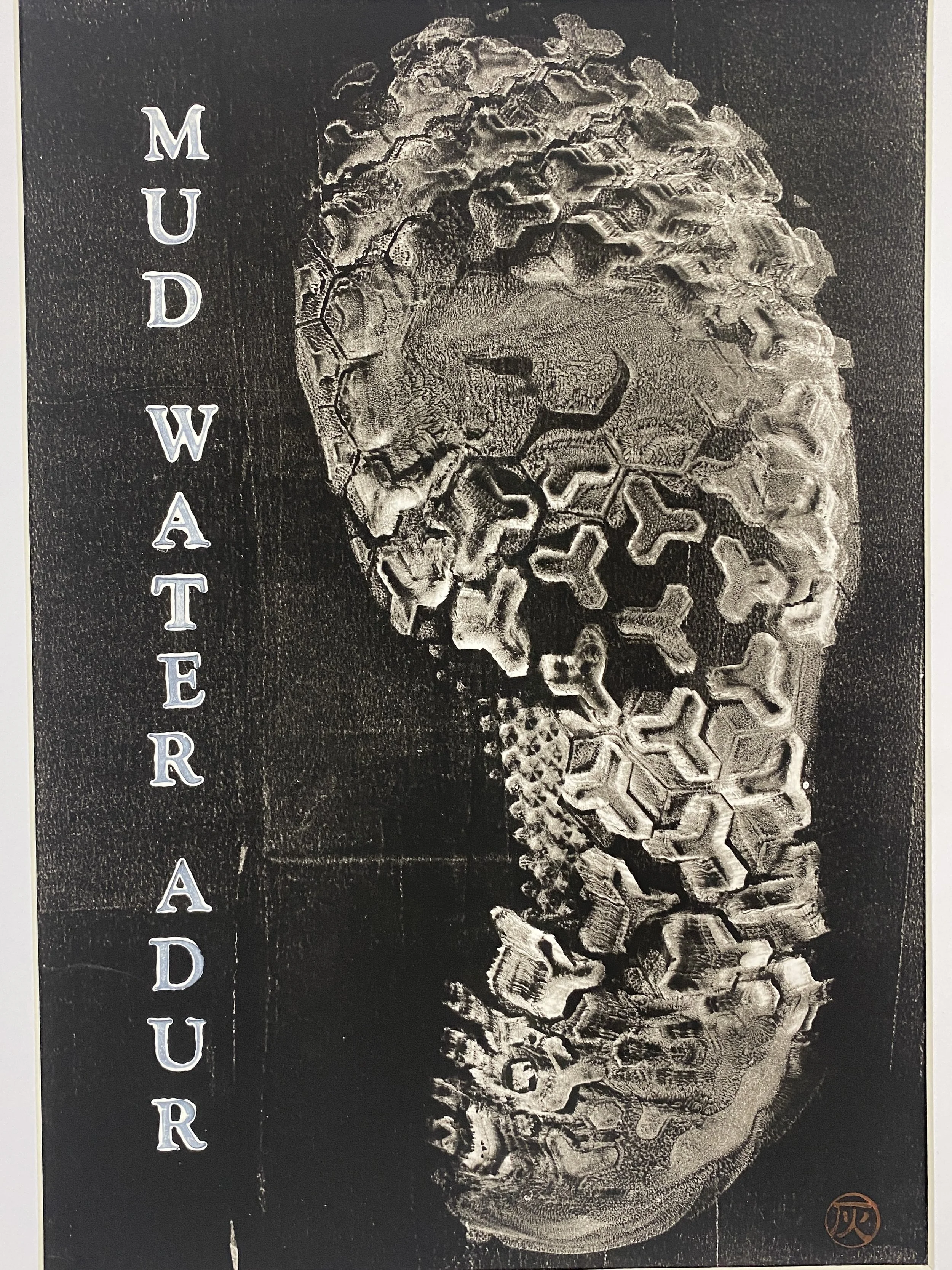 Minimalist artwork with vertical and horizontal lines creating rectangular shapes, framed and mounted on a white wall.