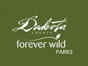 Logo for Dakota County Forever Wild Parks with green background and white text