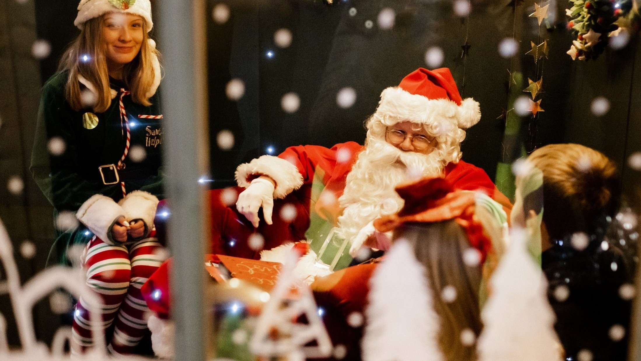 Father Christmas meeting children at the grotto